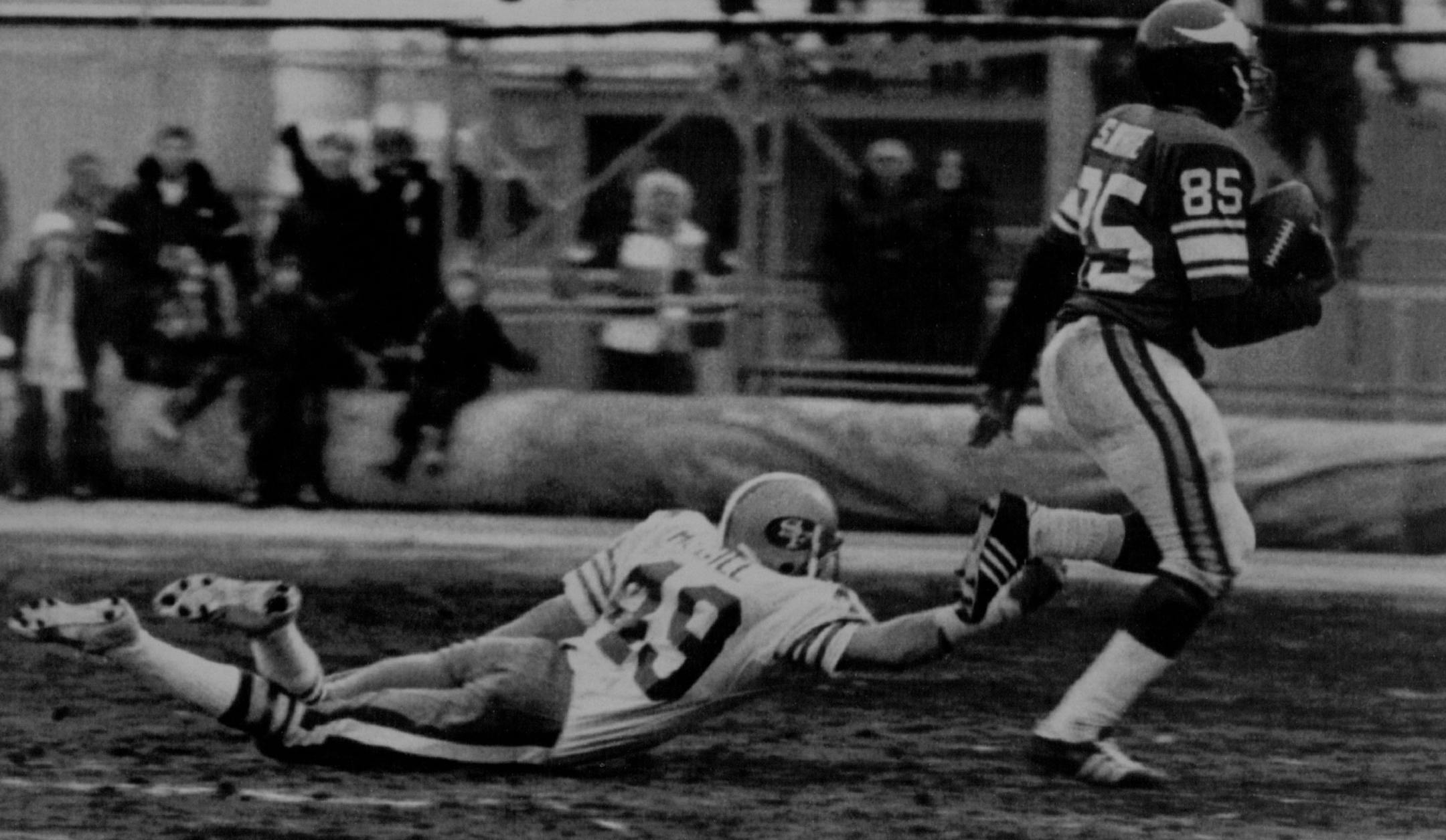 December 4, 1977 Winning Touchdown -- Ralph McGil (49) of the San Francisco 49ers falls in his vain attempt to stop Minnesota Vikings wide receiver Sammy White who scored the Vikings game winning touchdown on a 69-yard pass play from rookie quarterback Tommy Kramer in Sunday action. The Vikings won 28-27. PL, AP Laserphoto ORG XMIT: MIN2017013003283283