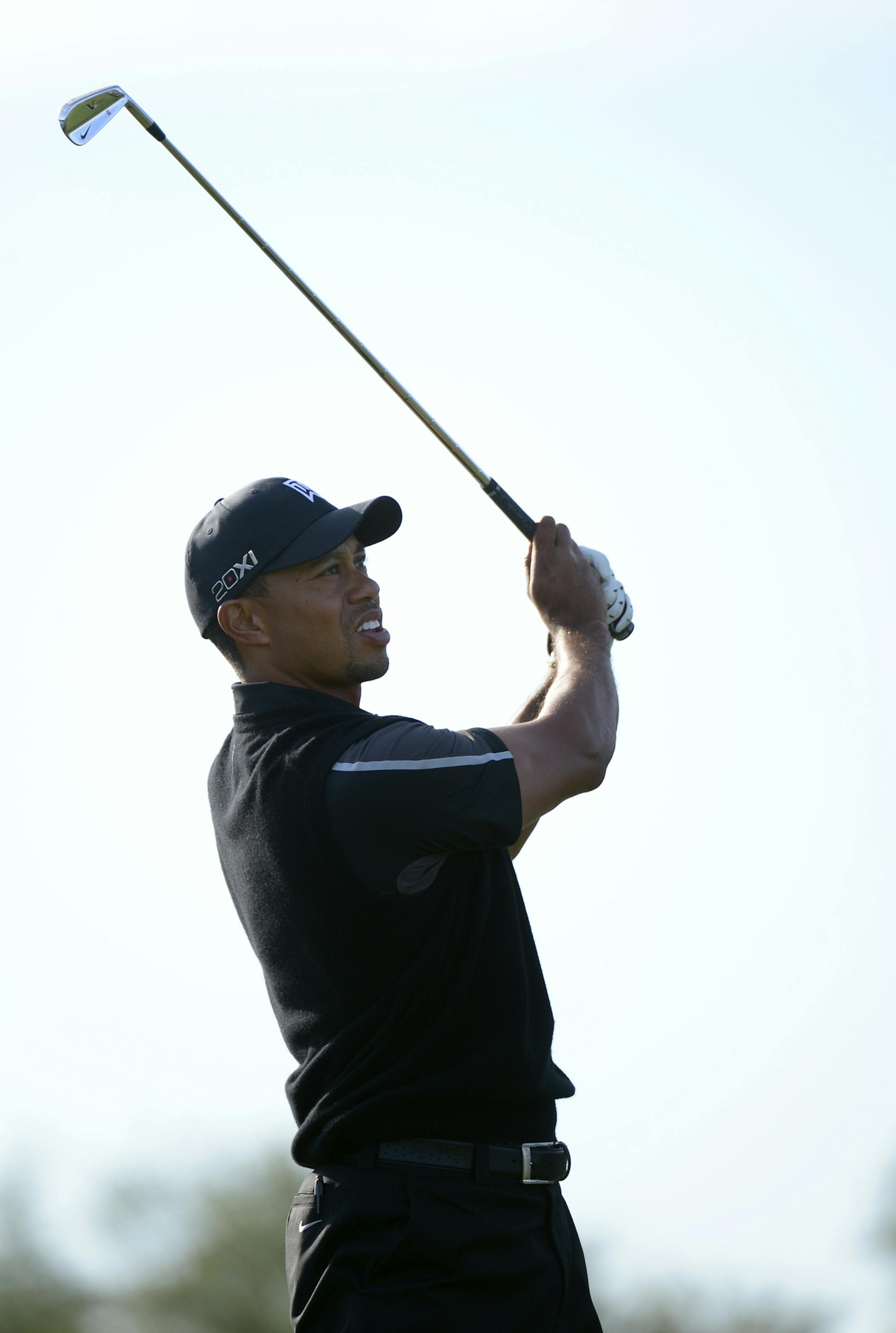 Tiger Woods watches his tee shot on the 14th hole during the first round of the Arnold Palmer Invitational golf tournament in Orlando, Fla., Thursday, March 21, 2013.(AP Photo/Phelan M. Ebenhack)