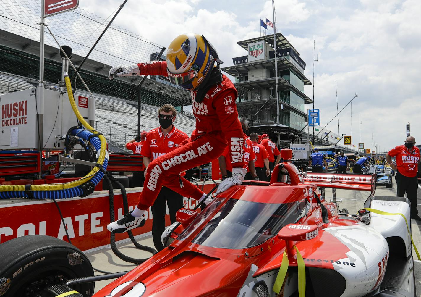 Race driver Marcus Ericsson, of Sweden, climbs out of his car following practice for the IndyCar auto race at Indianapolis Motor Speedway in Indianapolis, Friday, July 3, 2020. (AP Photo/Darron Cummings)