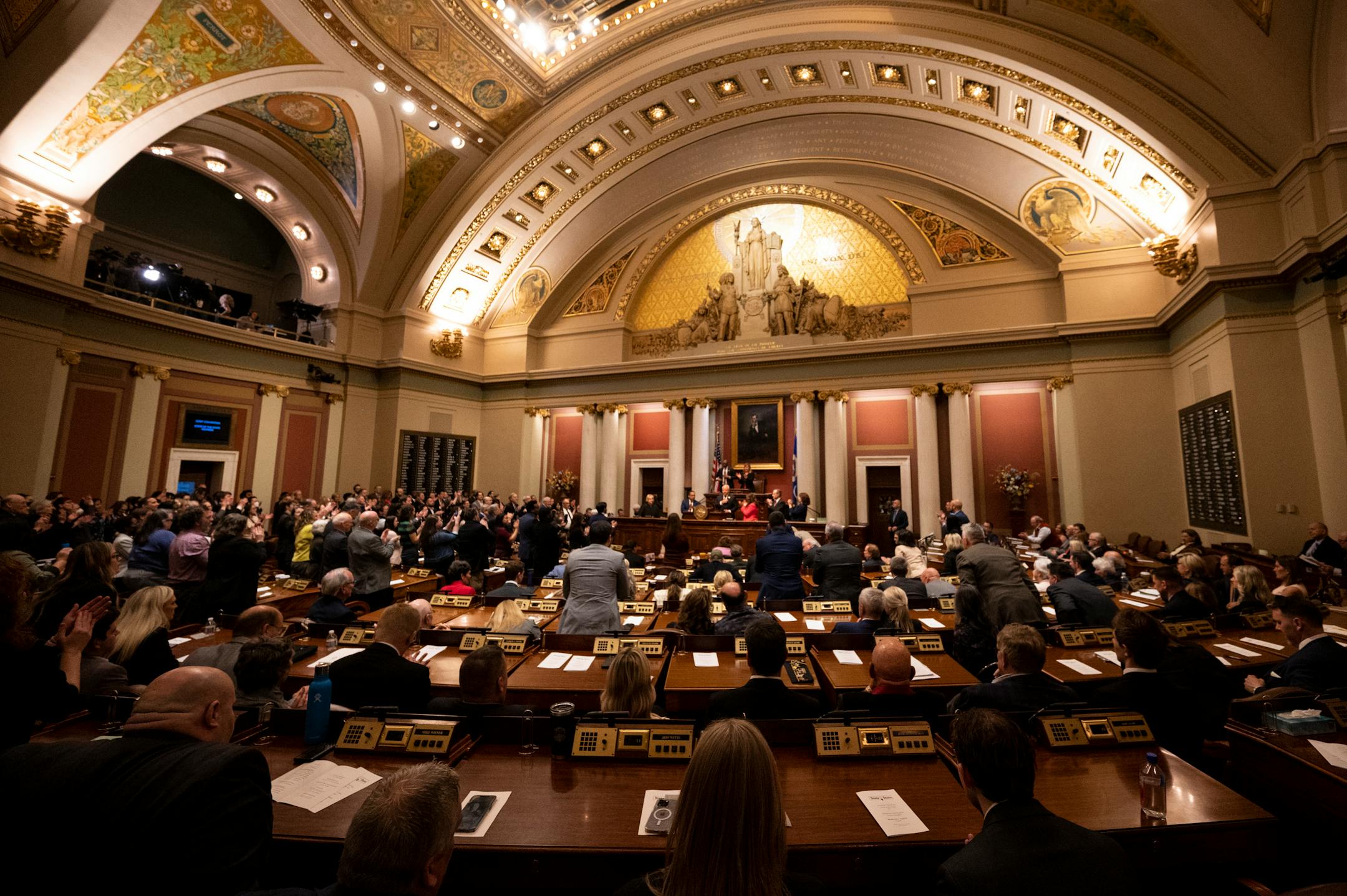 A divided house responds to Minnesota Gov. Tim Walz's remarks during the State of the State address Wednesday night  in the house chambers of the Minnesota State Capitol in St. Paul, Minn.