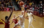 Minnesota Golden Gophers guard Carlie Wagner (33) scored over Indiana Hoosiers guard Bendu Yeaney (1) in the first half at Williams Arena Tuesday Feb 