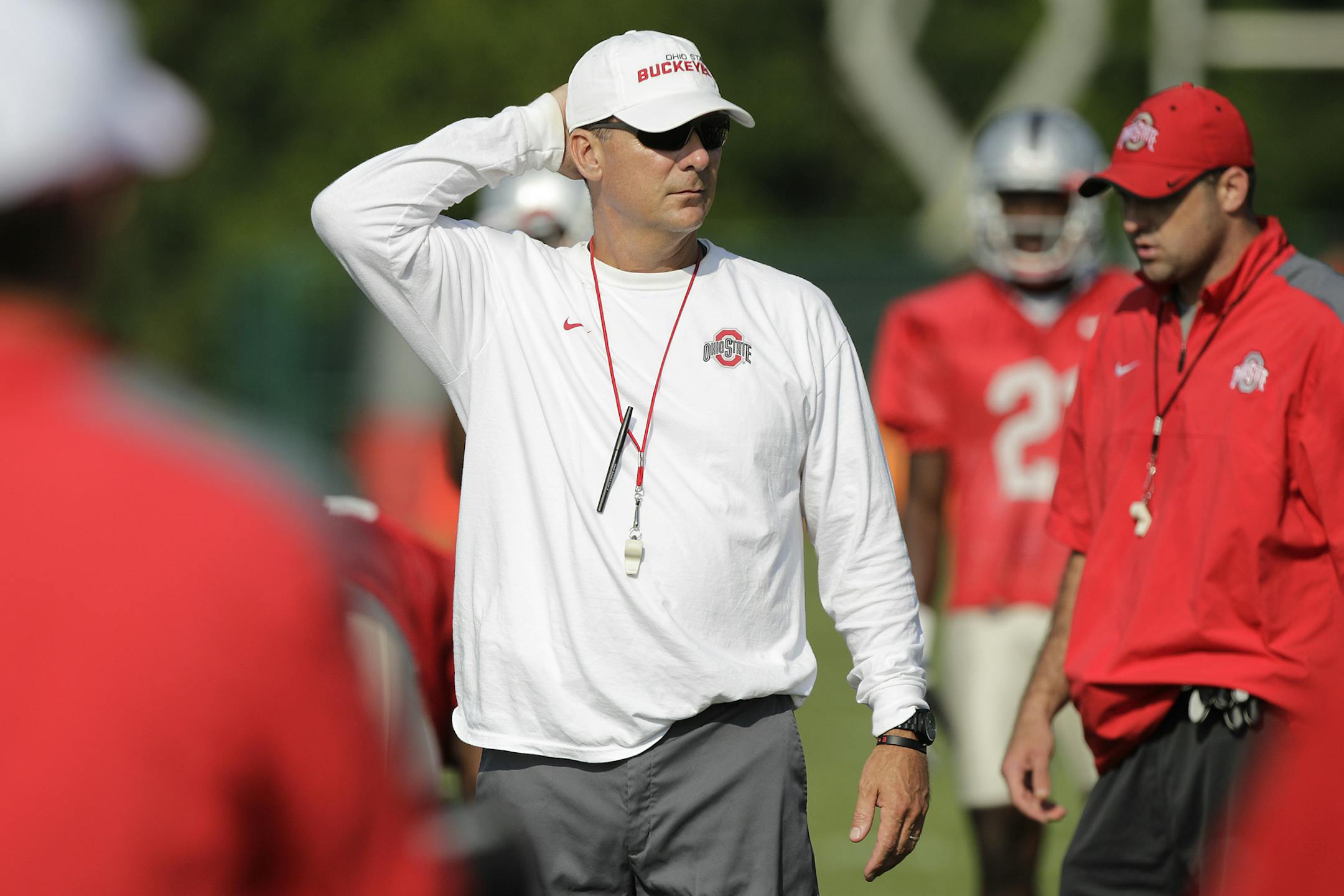 Ohio State head coach Urban Meyer watches his team during an NCAA college football practice Saturday, Aug. 9, 2014, in Columbus, Ohio. (AP Photo/Jay LaPrete)