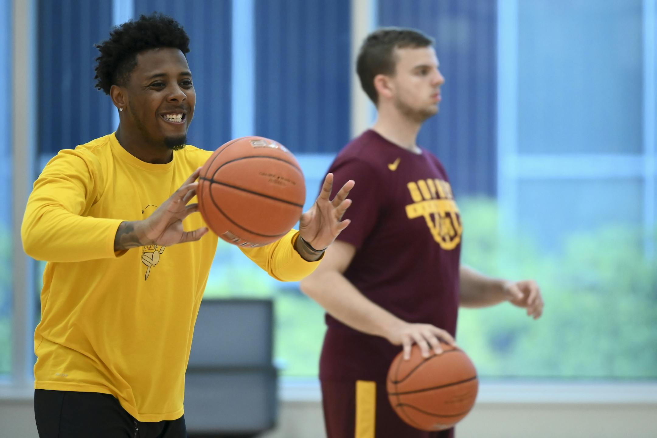 Graduate manager Jarvis Johnson passed the ball during Tuesday's practice.