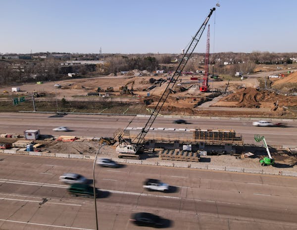 Afternoon rush hour traffic flows along the I-94 freeway Wednesday, April 12, 2023 just south of Oakdale, Minn.. Spring is here, and so is road constr