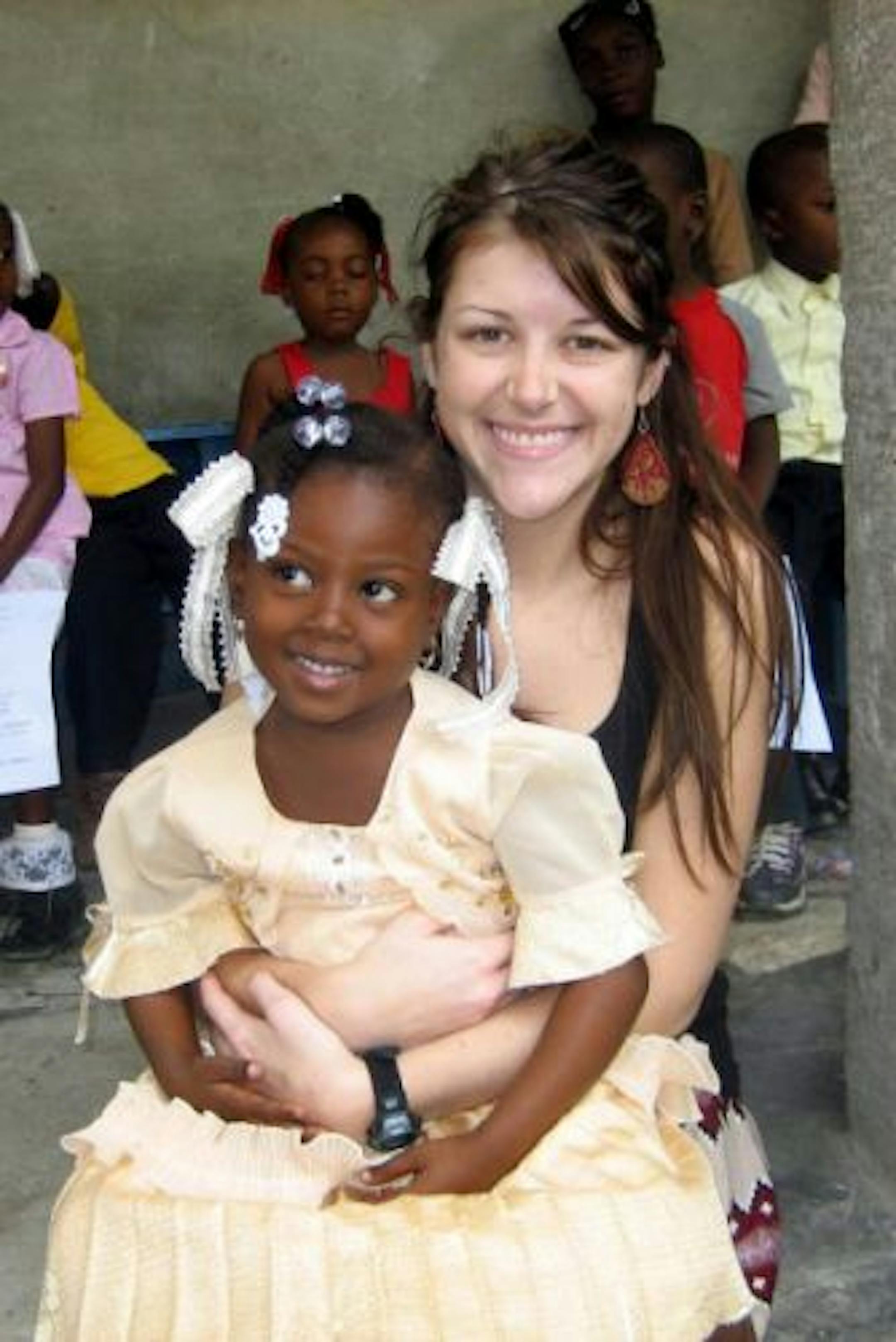 Lindsay Pruis gave help and comfort to Haitian children.