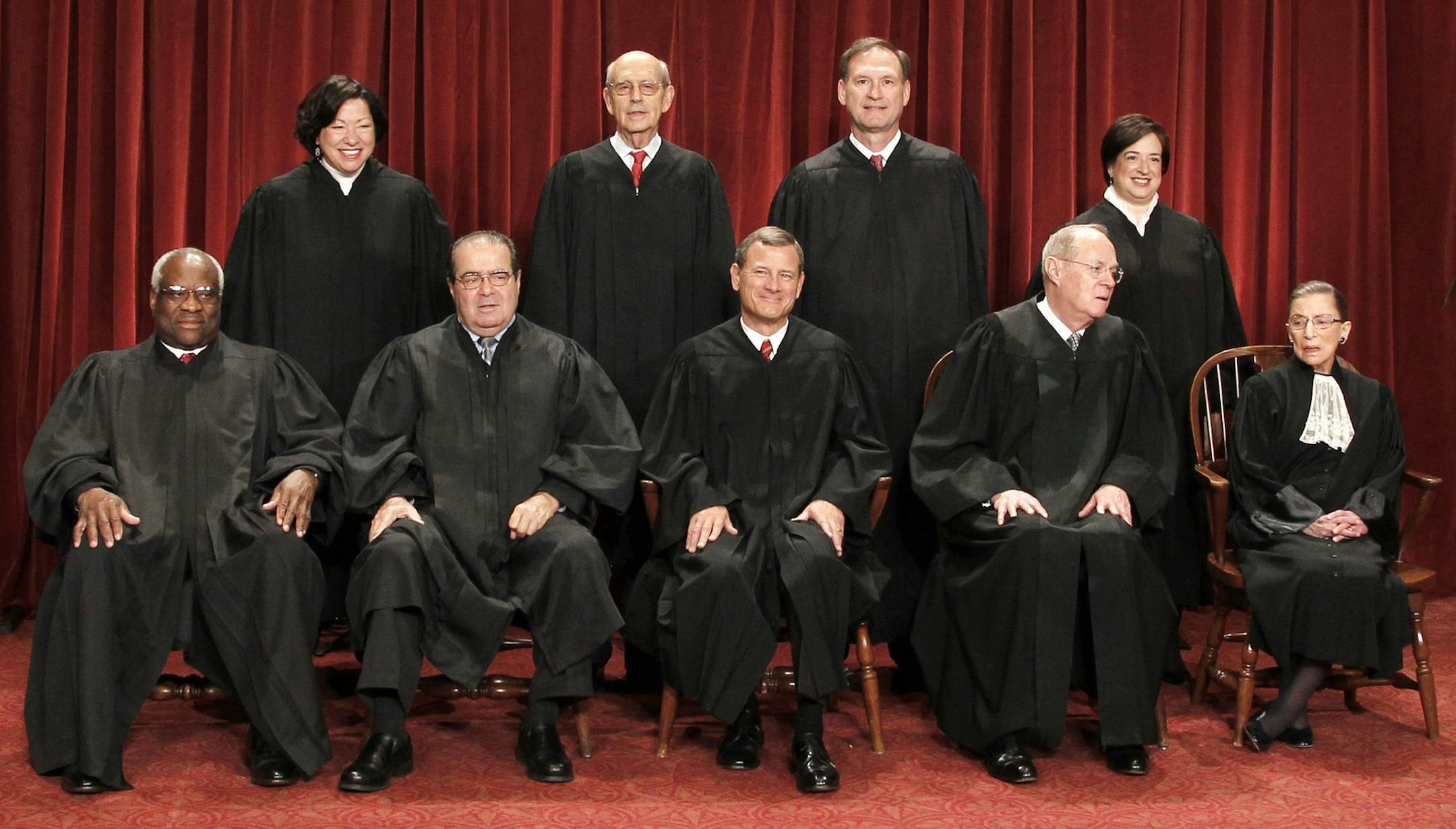 Members of the Supreme Court gather for a group portrait at the Supreme Court in Washington, Friday, Oct. 8, 2010. Seated from left are: Associate Justices Clarence Thomas, Antonin Scalia, Chief Justice John Roberts, Associate Justices Anthony M. Kennedy, and Ruth Bader Ginsburg. Standing, from left are: Associate Justices Sonia Sotomayor, Stephen Breyer, Samuel Alito Jr., and Elena Kagan. (AP Photo/Pablo Martinez Monsivais)