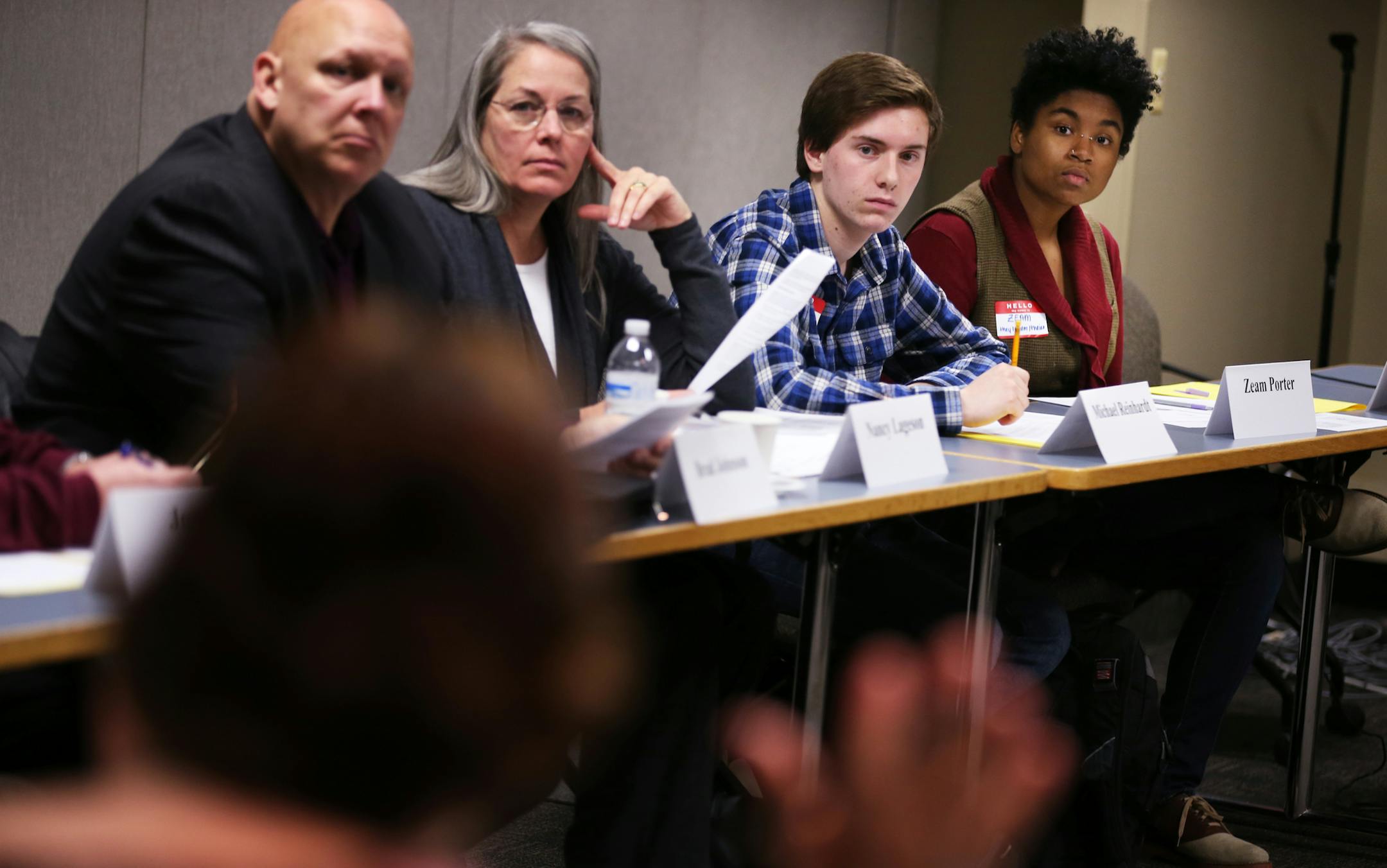 Student representatives Zeam Porter, from right, a junior at a high school in Minneapolis and Michael Reinhardt, a senior at Jefferson High School in Bloomington, attend a meeting of the School Safety Technical Assistance Council at the Minnesota Department of Education in Roseville, Minn. ] LEILA NAVIDI leila.navidi@startribune.com / BACKGROUND INFORMATION: Tuesday, November 18, 2014. The new School Safety Technical Assistance Council is the group charged with implementing the new anti-bullying
