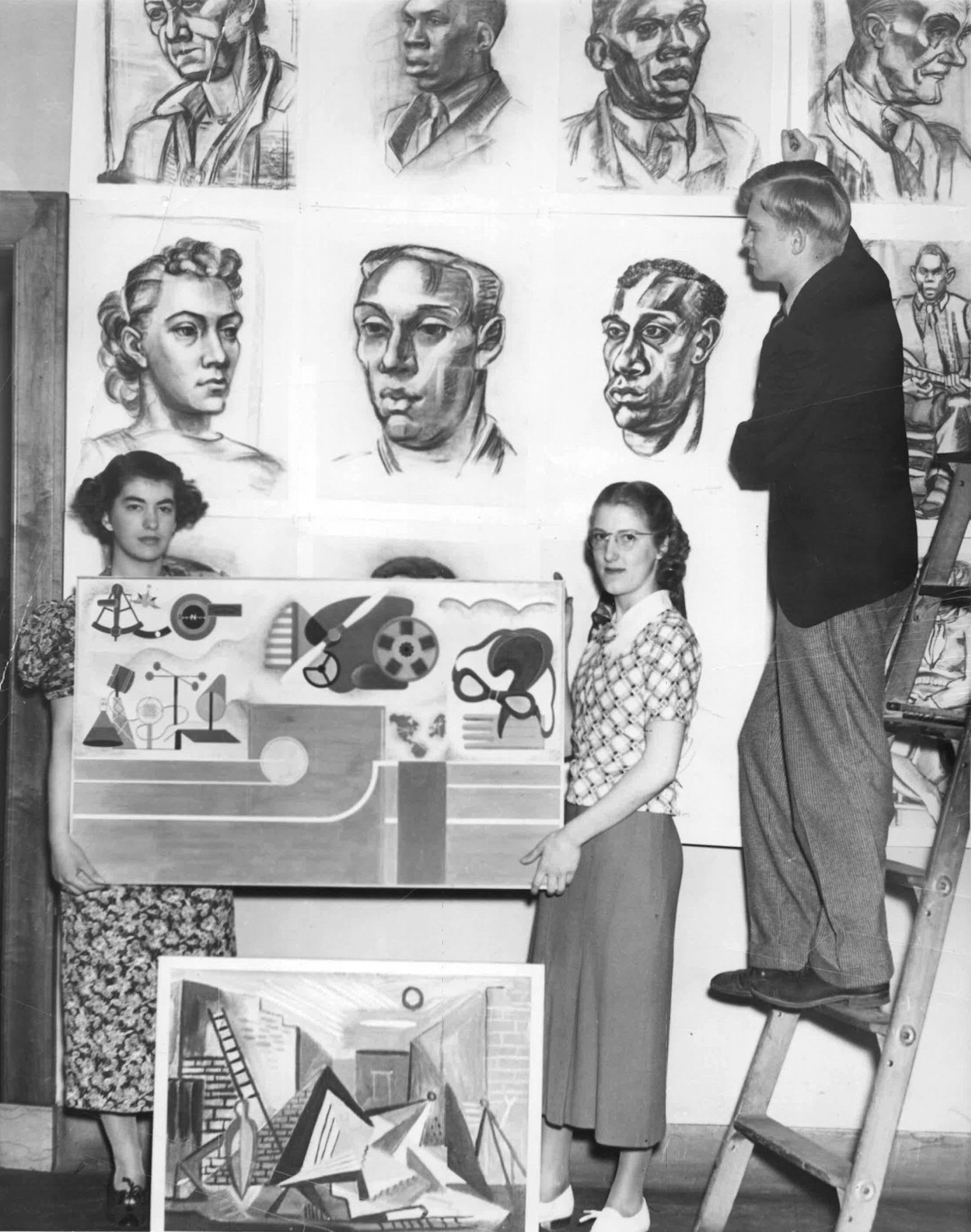 May 18, 1937: Artists install their work for a student art exhibition at the St. Paul School of Art (a predecessor of Minnesota Museum of American Artt). Archival photo courtesy of Minnesota Museum of American Art.