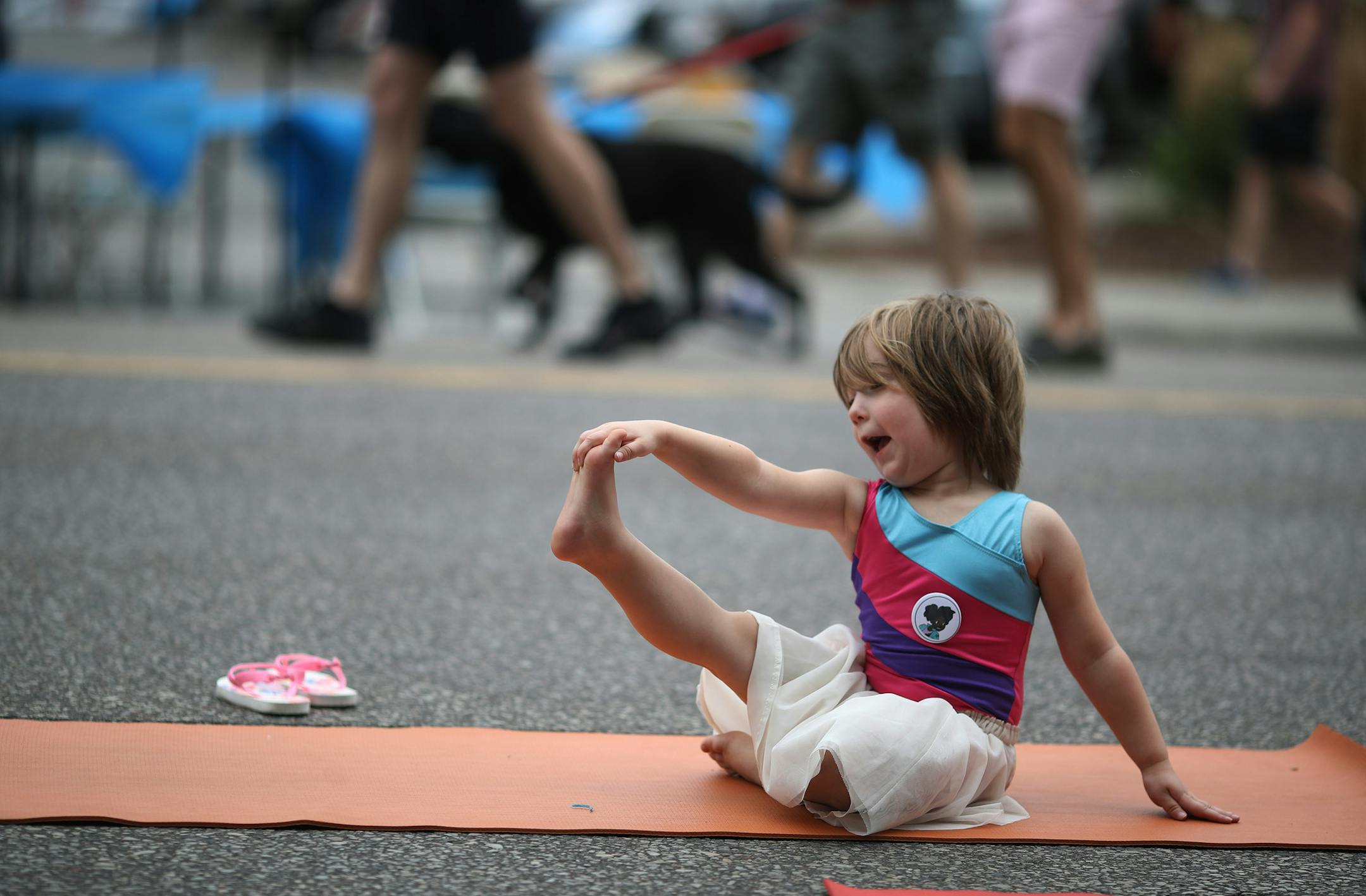 Leona Cronin 4, joined others who did a Blooma yoga morning yoga session on Lyndale Ave near Lake street during Open Streets Minneapolis on Lyndale Ave S Sunday June 10, 2018 in Minneapolis, MN. ] JERRY HOLT ï jerry.holt@startribune.com