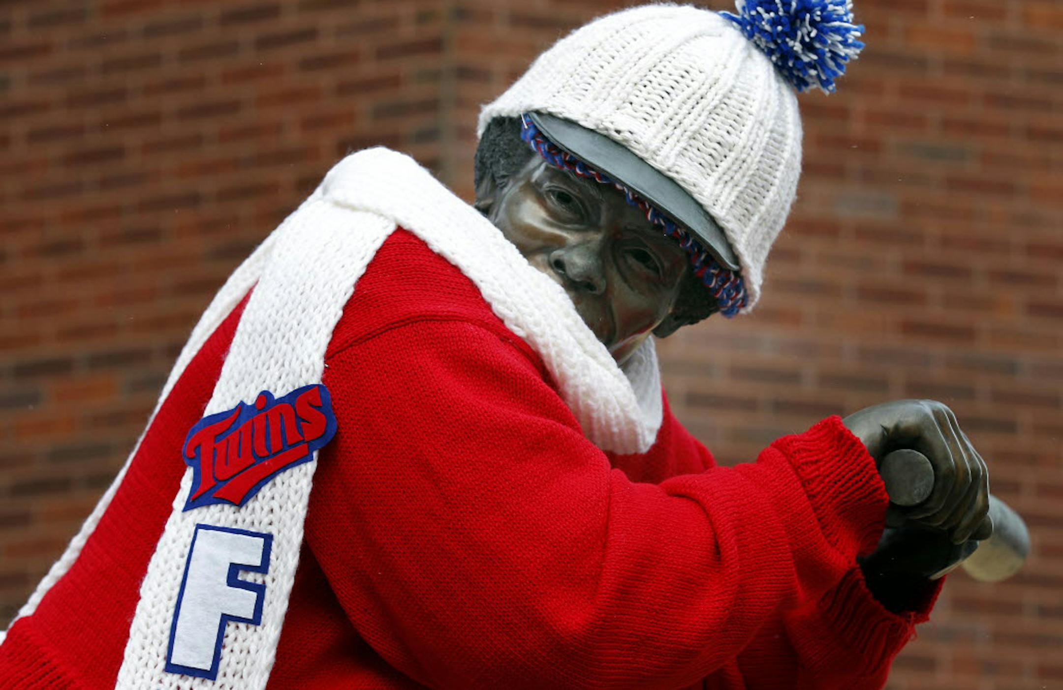 A statue of Hall-of-Famer and former Minnesota Twins baseball player Rod Carew was dressed in a hat, scarf and sweater outside Target Field on Sunday, just ahead of what is expected to be the coldest air in four years.