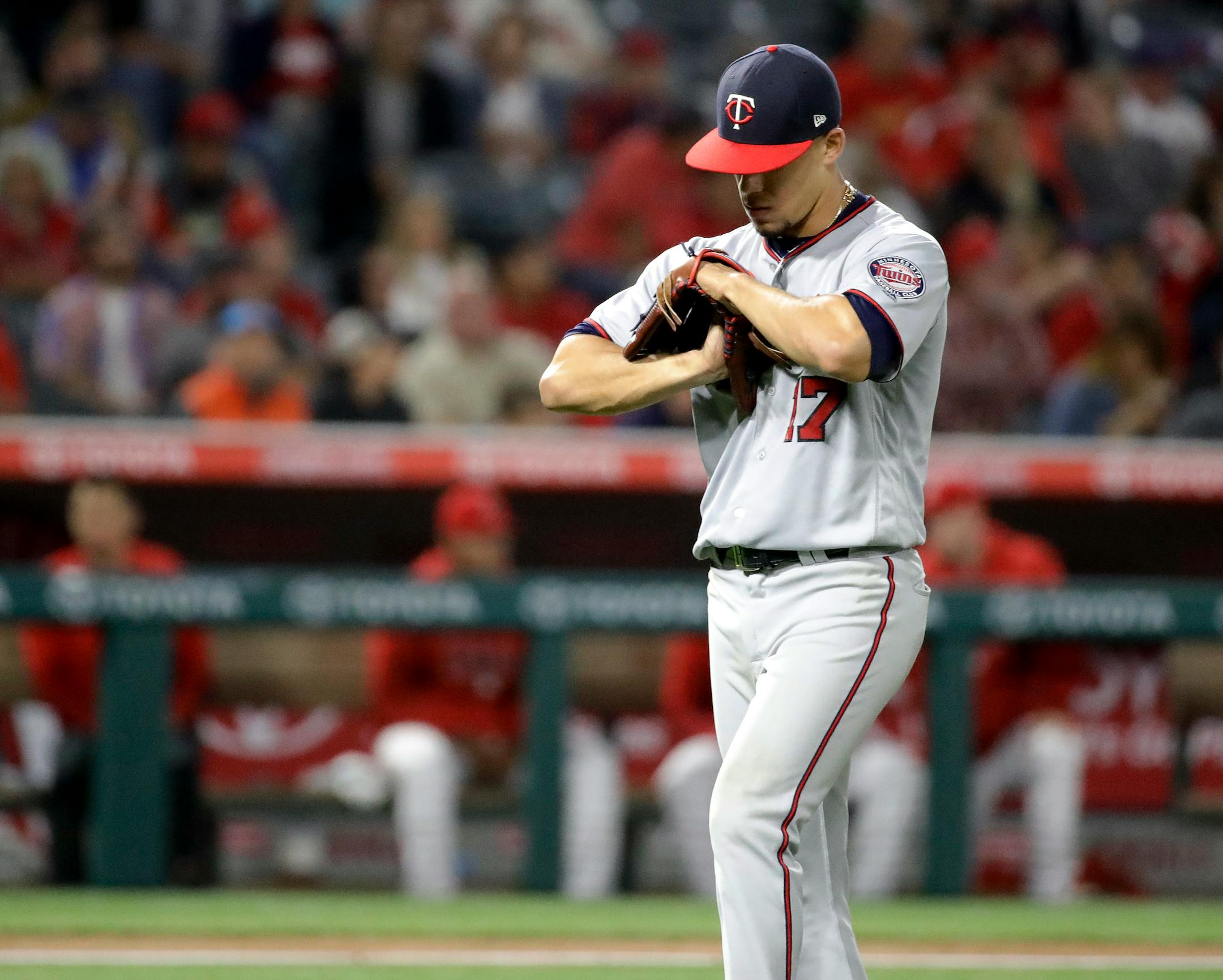Minnesota Twins starting pitcher Jose Berrios walks off the field after being taken out of the baseball game against the Los Angeles Angels during the sixth inning in Anaheim, Calif., Thursday, May 10, 2018. (AP Photo/Chris Carlson)