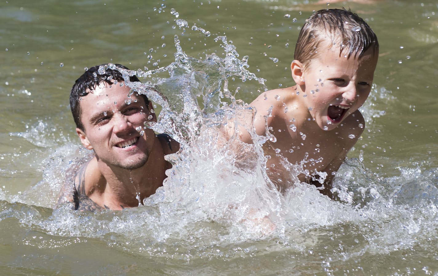 Shaun Fleck played with his son, Kash Fleck, 5, as they splashed around at quarry number 11 at Quarry Park and Nature Reserve on Saturday. ] Isaac Hale &#x2022; isaac.hale@startribune.com People took to the swimming holes at Quarry Park and Nature Reserve in St. Cloud, MN, on Saturday, July 30, 2016. One of the more popular areas to swim in Minnesota, the park attracts families as well as teenagers and young adults who jump off some of the cliffs surrounding the waters.