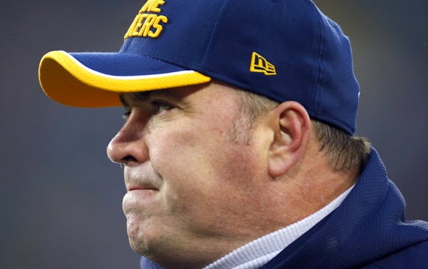 Green Bay Packers head coach Mike McCarthy watches his team play the Philadelphia Eagles during an NFL football game on Sunday, Nov. 16, 2014 in Green
