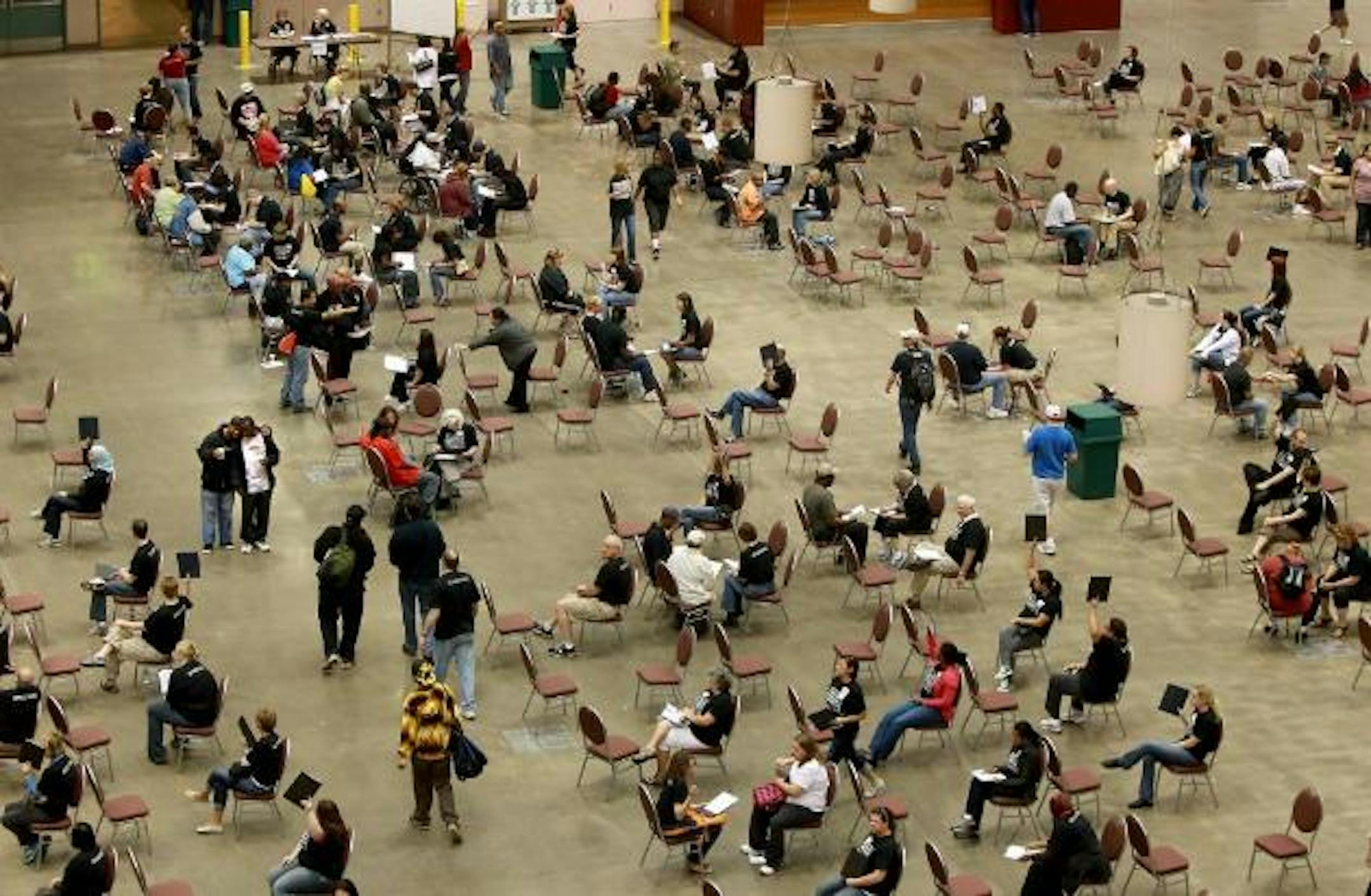 Visitors to the annual Project Homeless Connect event made their way to registration lines at the Minneapolis Convention Center, Monday, May 14, 2012.