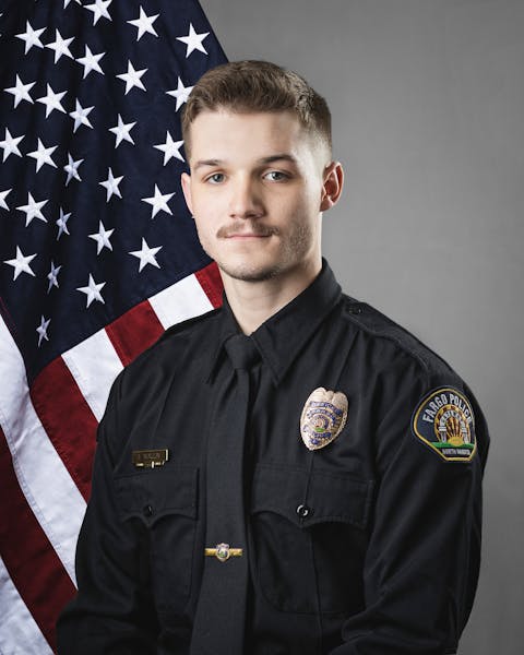 Jake Wallin was killed Friday when a gunman opened fire on police and firefighters as they responded to a traffic crash, Fargo’s police chief said. 