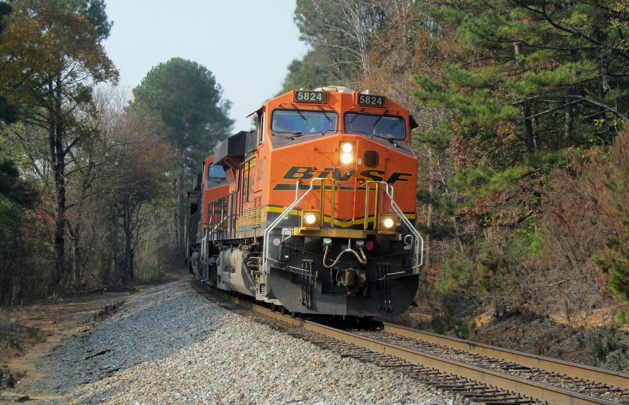 In this November 14, 2016 photo, a Burlington Northern Santa Fe (BNSF) locomotive leads a freight train through Dallas, Ga., November 14, 2106. Locomotive number 5824 is an ES44AC model built by GE Transportation Systems. (AP Photo/Henry Durand)