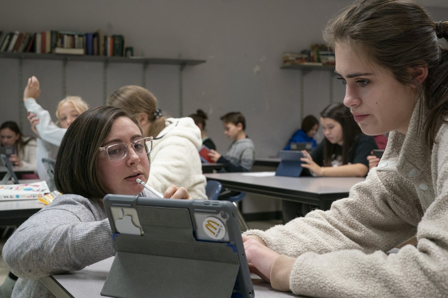 Minnetonka English teacher Tessa Ikola left worked with 9th grader Kate Simington on ipads in her class.] Jerry Holt &#x2022; Jerry.holt@startribune.com Minnetonka High School students using ipads in the classrooms Wednesday Oct. 30, 2019. in Minnetonka, MN. Jerry Holt