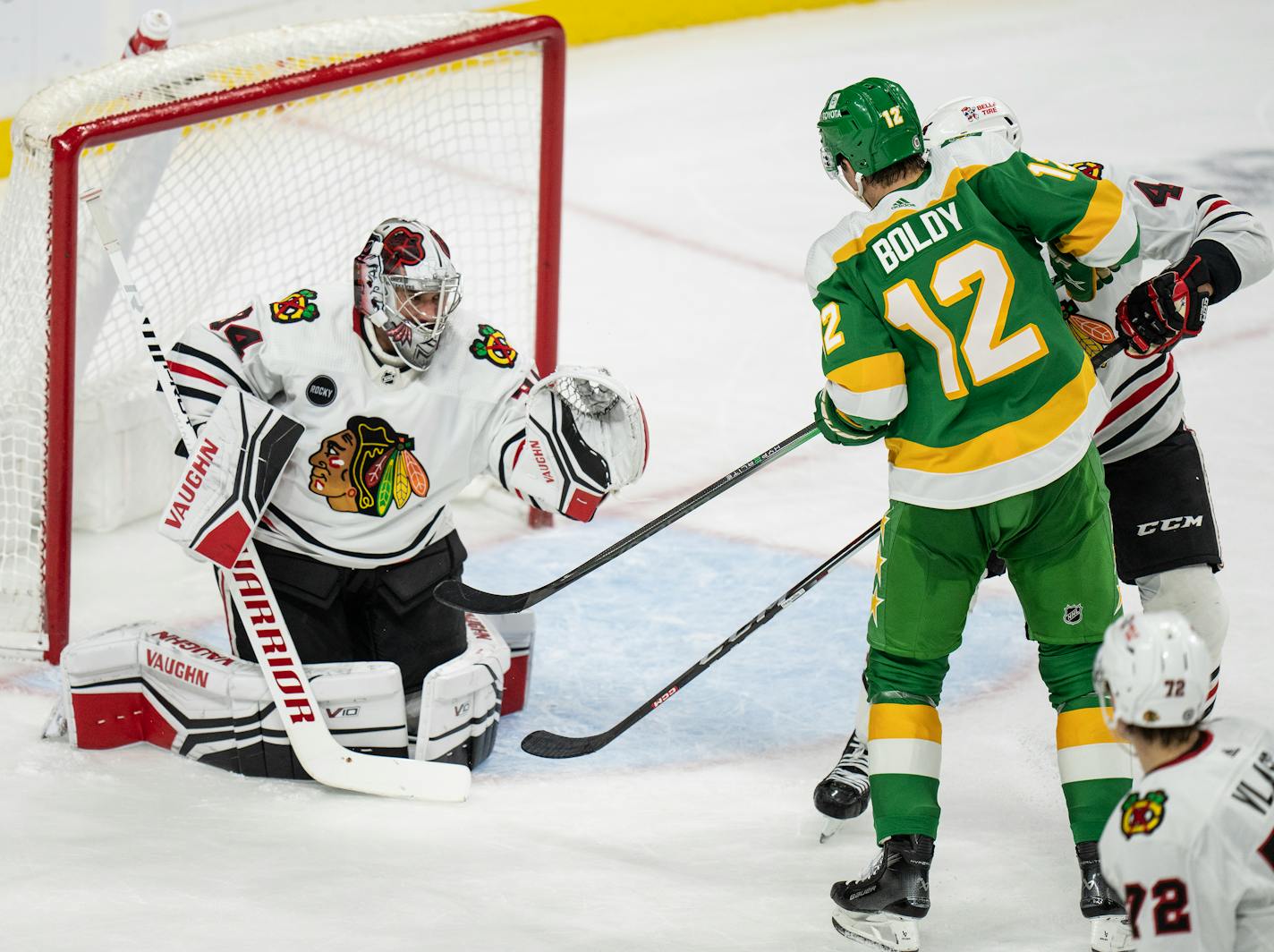 Minnesota Wild left wing Matt Boldy (12) tipped a 2nd period goal passed Chicago Blackhawks goaltender Petr Mrazek (34) December 3 ,2023 in, St. Paul, Minn. ] JERRY HOLT • jerry.holt@startribune.com