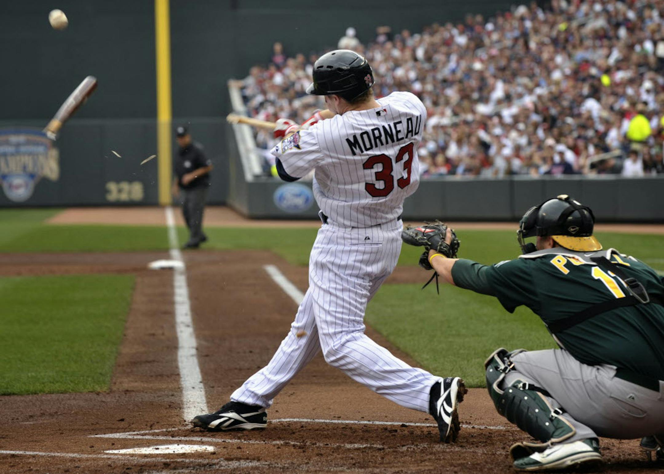 The Twins' Justin Morneau got a broken-bat single during the first inning against Oakland on Sunday.