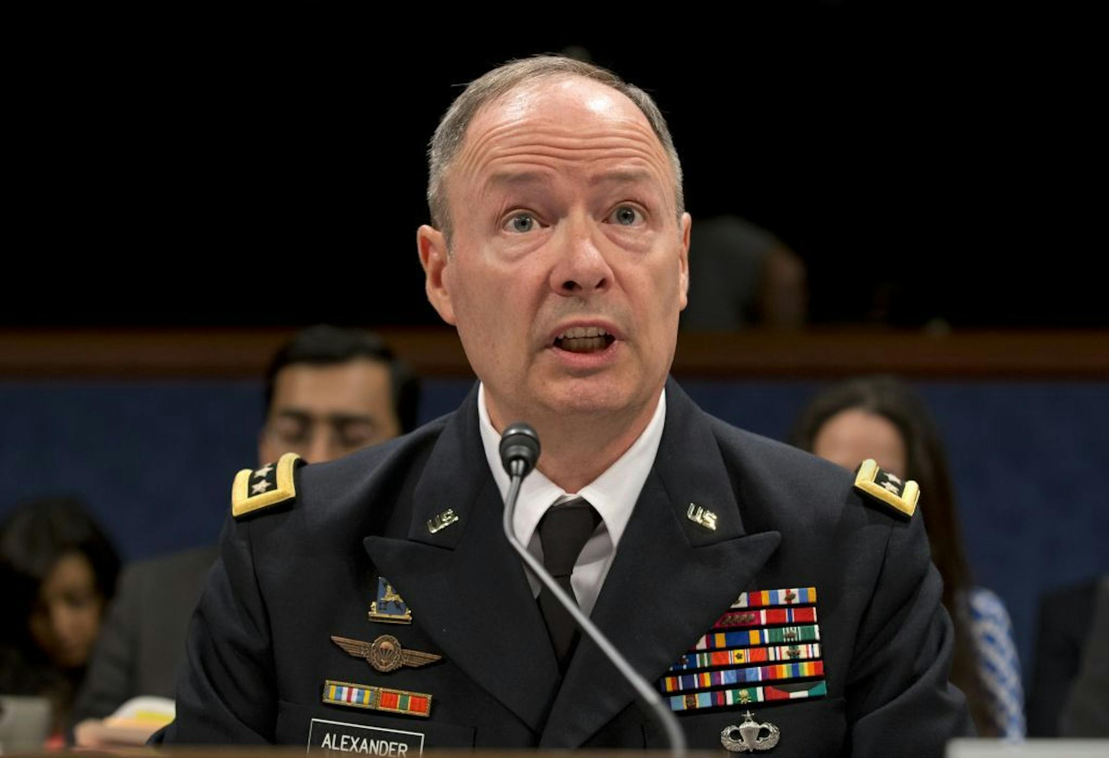 Gen. Keith B. Alexander, director of the National Security Agency and head of the U.S. Cyber Command, testifies before the House Permanent Select Committee on Intelligence, on Capitol Hill in Washington, Tuesday, June 18, 2013. Amid revelations that the electronic surveillance agency is sweeping up Americans' phone and Internet records in its quest to investigate terrorist threats, President Barack Obama defended top secret National Security Agency spying programs as legal during an interview ye