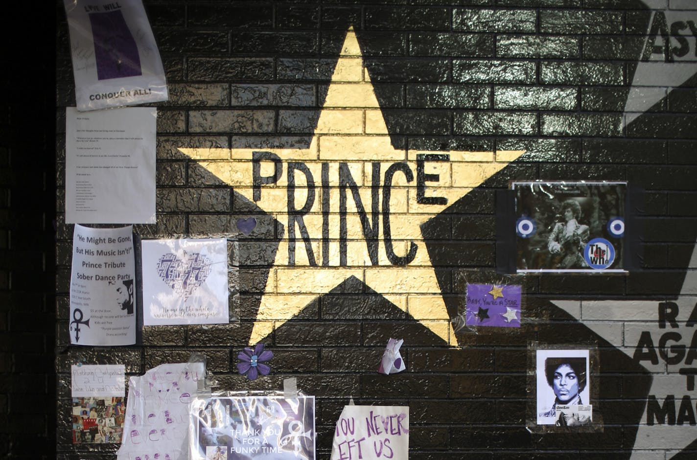 Prince's star on the wall of First Ave. was painted gold sometime overnight. ] JEFF WHEELER • jeff.wheeler@startribune.com A steady stream of Paul McCartney fans paused to view Princes's newly gold star on the wall outside First Ave. on their way to Target Center in Minneapolis Wednesday evening, May 4, 2016.