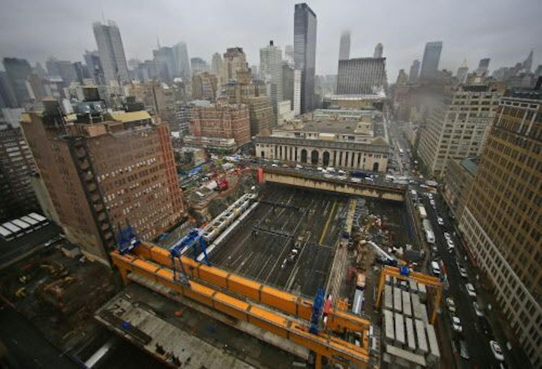 This photo shows ongoing construction of Brookfield Manhattan West project site over rail tracks used by commuter trains at Penn Station, Wednesday April 16, 2014 in New York.