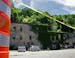 Yellow tape and orange cones block off the parking lot of the historic Jordan Brewery after a mudslide severely damaged the building two weeks ago dur