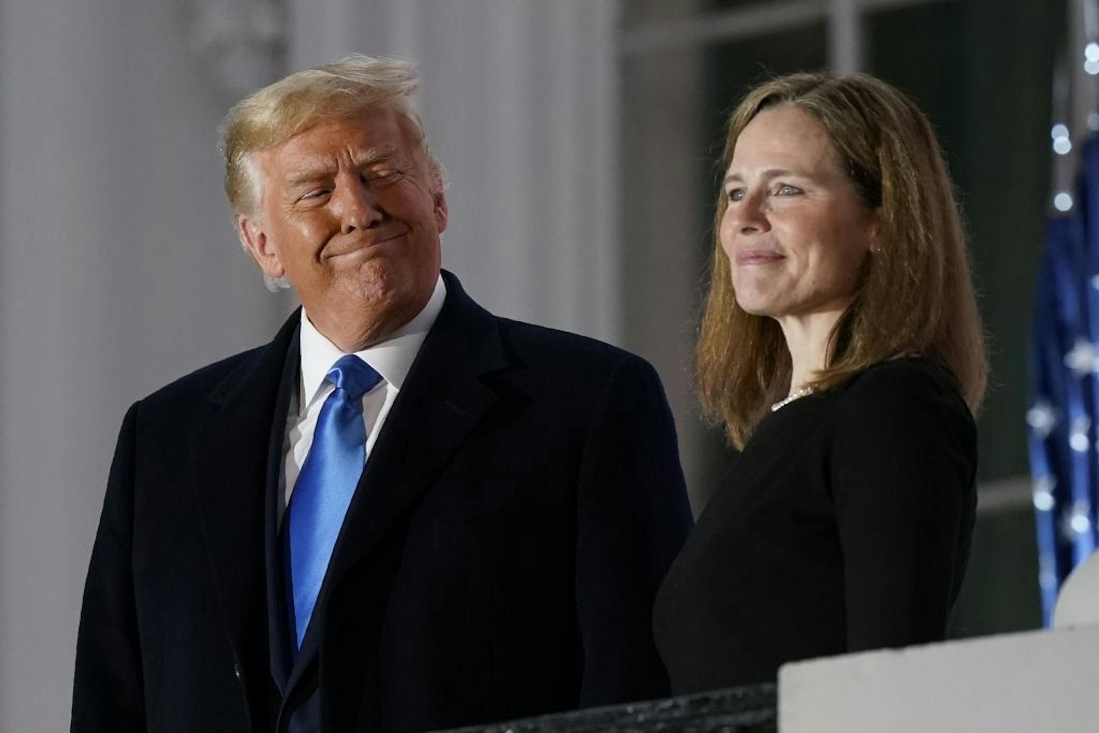 President Donald Trump and Amy Coney Barrett stood on the Blue Room Balcony after she was confirmed to the Supreme Court on Oct. 26, 2020.
