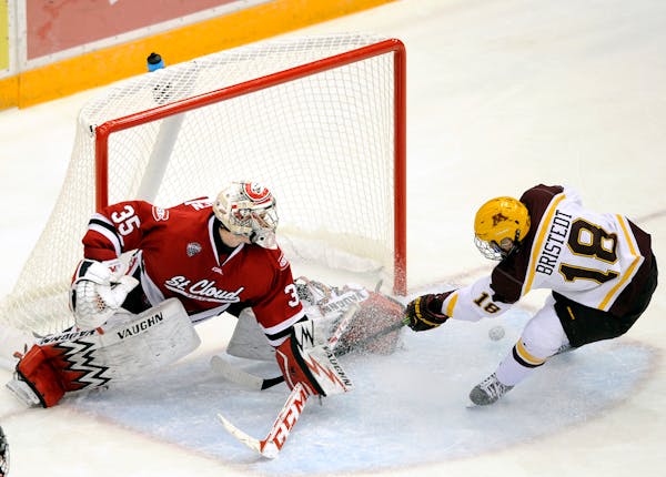 St. Cloud State goalie Charlie Lindgren (35) blocks a shot by Minnesota forward Leon Bristedt (18), of Sweden, during the third period of an NCAA coll