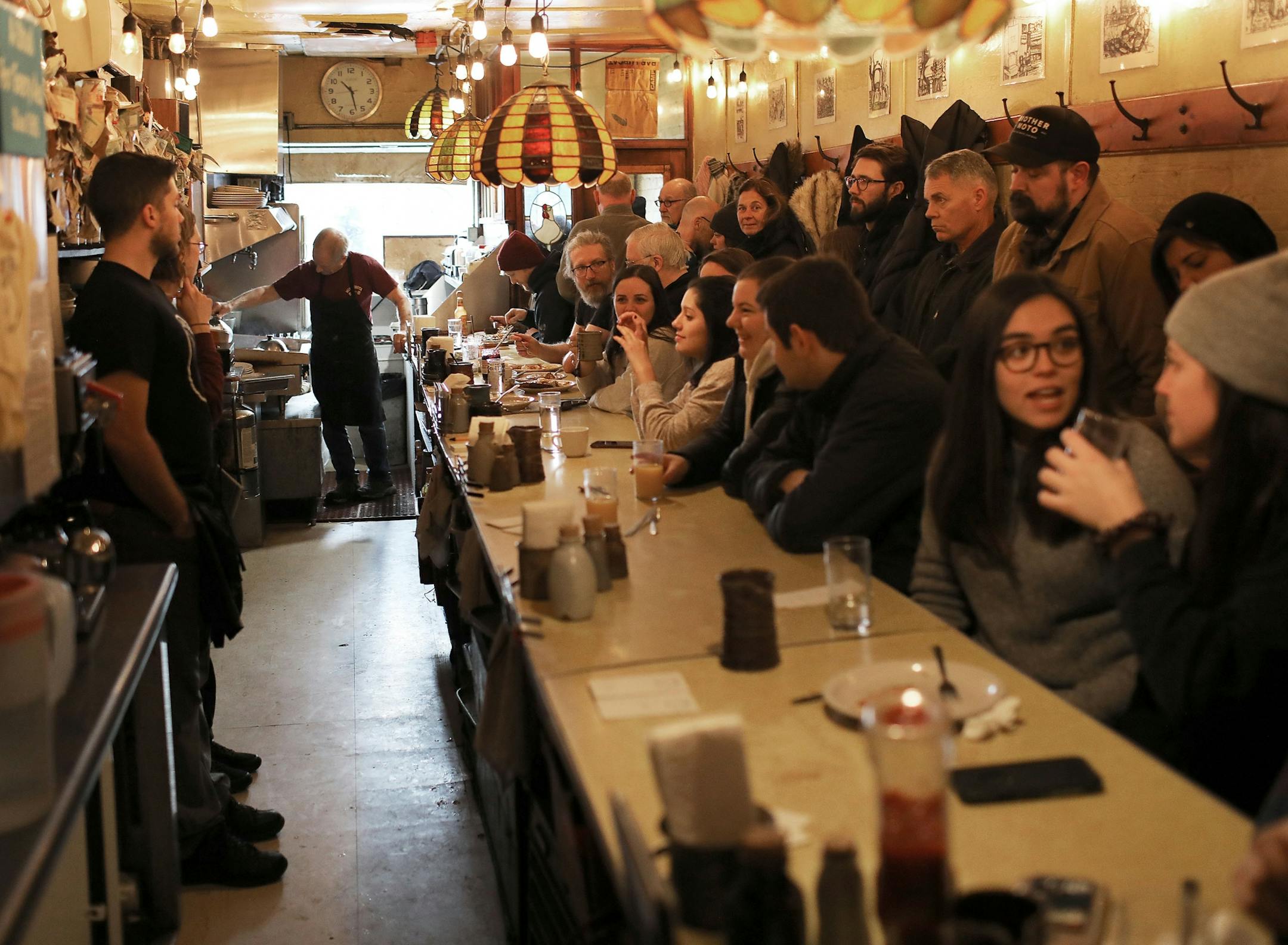 Doug Grina, a staple character at Al's Breakfast for 42 years, works behind the counter on Wednesday, Dec. 18, 2019.