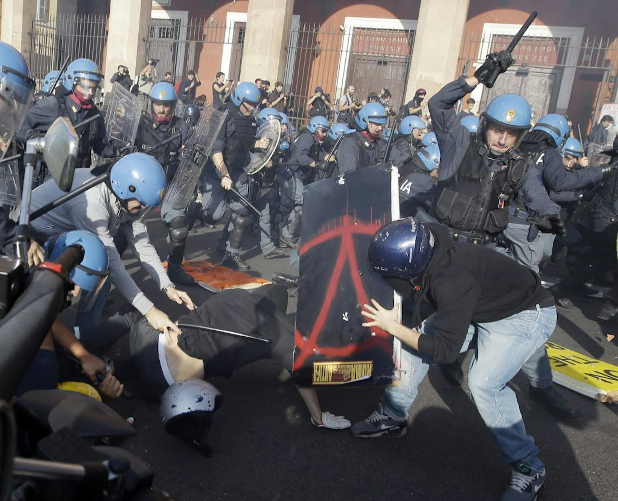 Police clash with demonstrators during a protest against Italian Government austerity measures in Rome, Wednesday, Nov. 14, 2012. Workers across the European Union sought to present a united front against rampant unemployment and government spending cuts Wednesday with a string of strikes and demonstrations across the region. Protesters clashed with police in various demonstrations in Rome, Milan, Turin, Padua and Brescia.