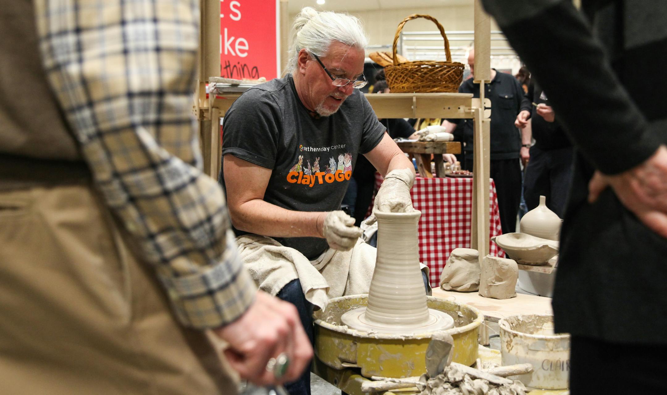 Kevin Caufield, the owner of the Caufield Clay Works in St. Paul, is demonstrating how to do ceramics to Douglas and Ruth Crane. ] XAVIER WANG • xavier.wang@startribune.com The American Craft Show returns to St. Paul on April 7th to 9th, 2017 at the RiverCenter in St. Paul, and more than 225 artists from the entire country attend the show.
