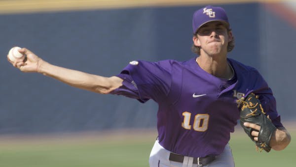 LSU&#x2019;s Aaron Nola pitches against Arkansas during the Southeastern Conference NCAA college baseball tournament on Thursday, May 22, 2014, in Hoo