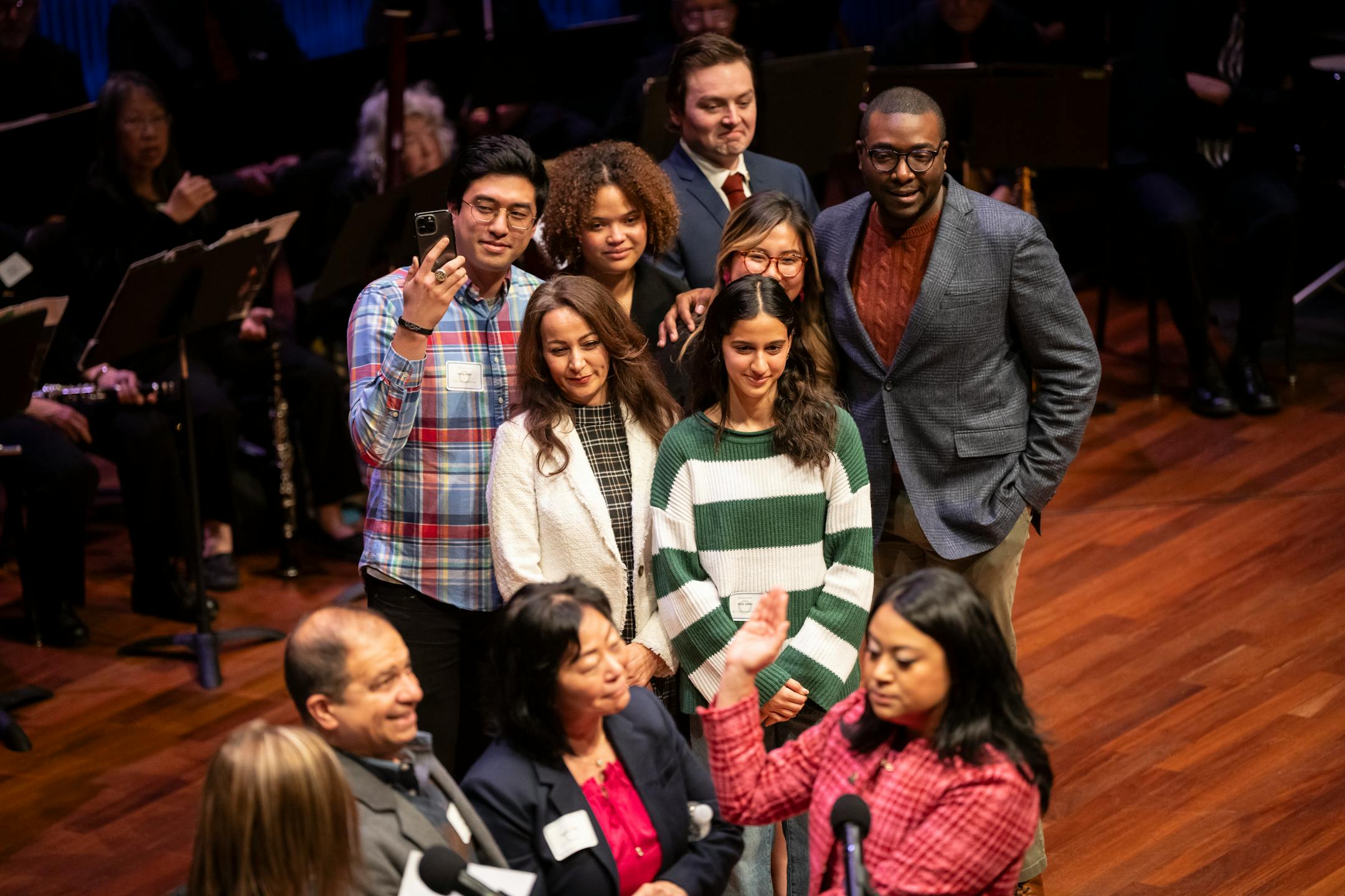 Loved ones of Council President Mitra Jalali, Ward 4, look on as she is sworn in with her parents holding her book at the swearing in ceremony of the seven female St. Paul city council members, four new to the council, at the Ordway Center on Tuesday, Jan. 9, 2024 in St. Paul, Minn. ] RENEE JONES SCHNEIDER • renee.jones@startribune.com