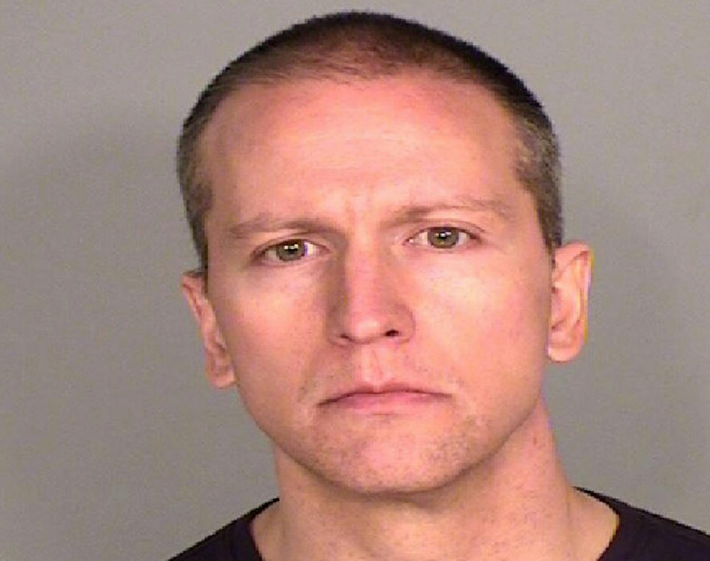 Fired Minneapolis police officer Derek Chauvin, charged with murder, manslaughter in George Floyd death, shown in a jail booking photo.