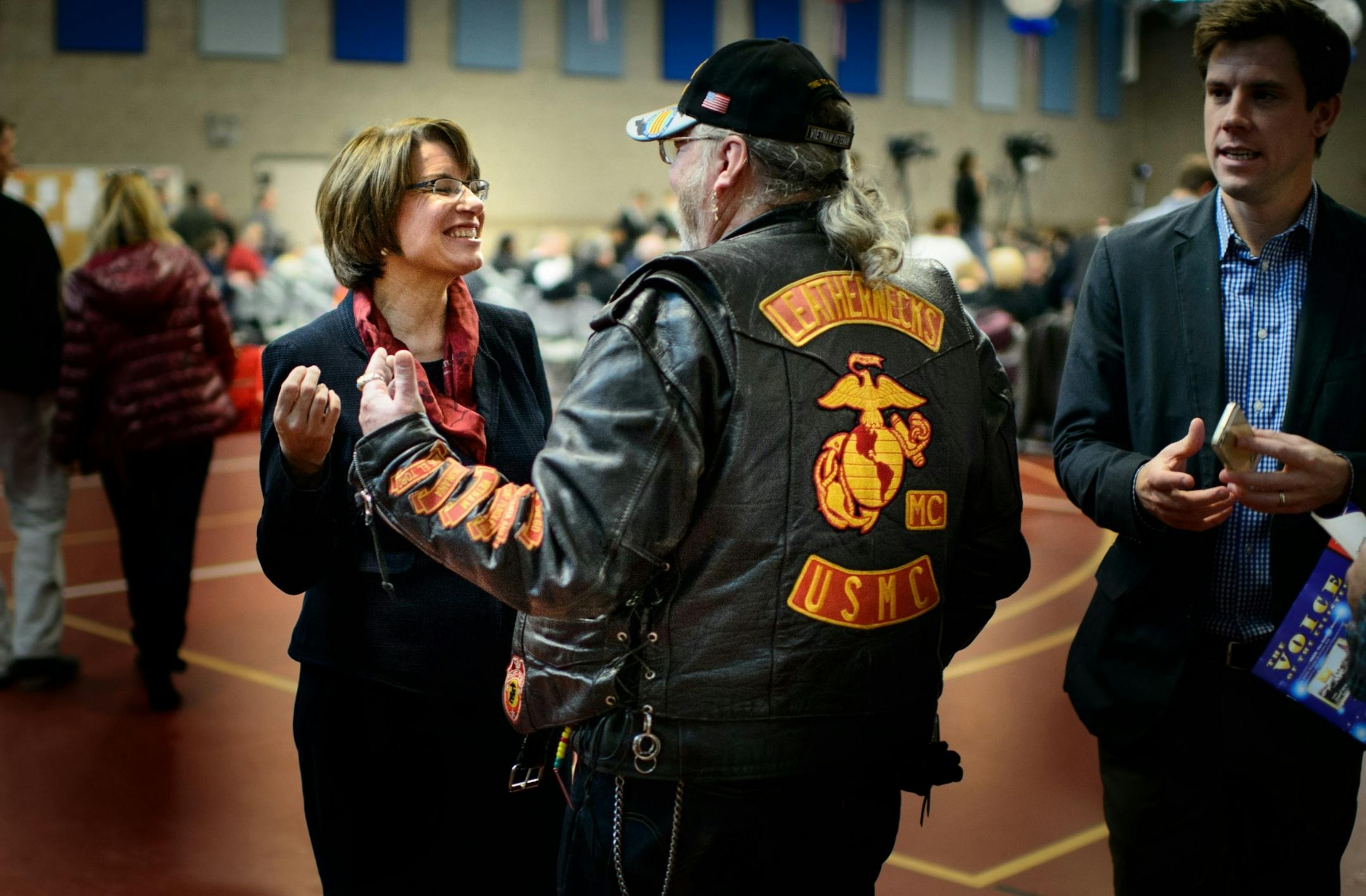 Sen. Amy Klobuchar laughed with Vietnam vet Mike Huysentruit before the Minnesota Veterans Day program in Inver Grove Heights in 2014.