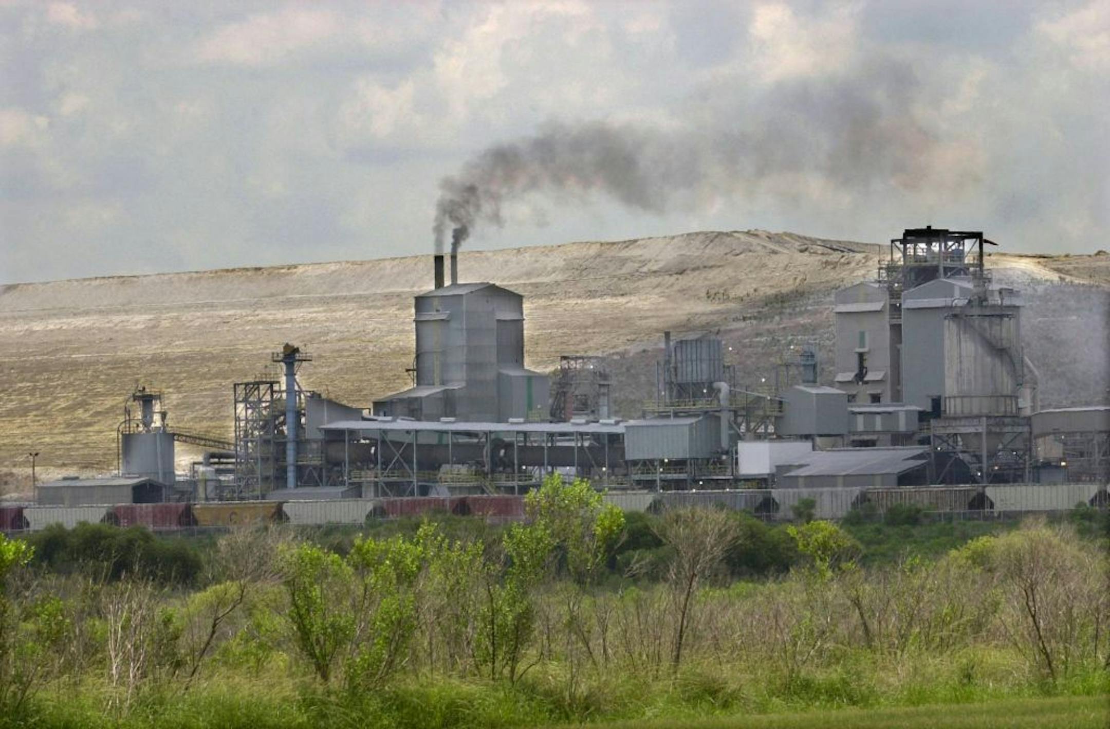 A large gypsum stack provided a backdrop Monday to Mosaic's IMC- Agrico New Wales fertilizer processing complex near Mulberry, Fla.