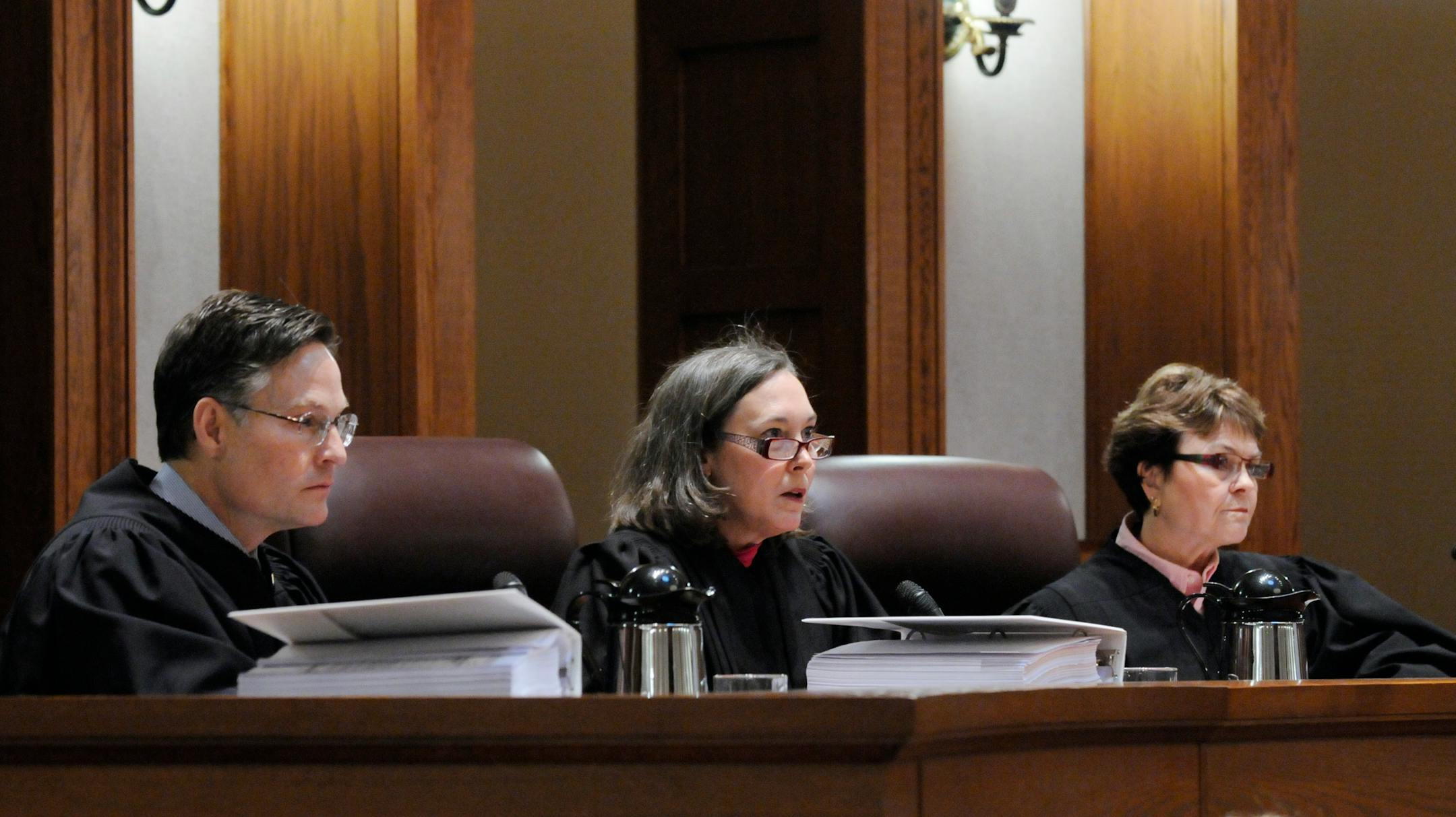 Judge Denise Reilly, center, asked a question as Judges Kurt Marben and Elizabeth Hayden listened during the Senate vote recount trial Tuesday in St. Paul. Norm Coleman's camp brought several voters before the panel to explain why their vote should have been counted.