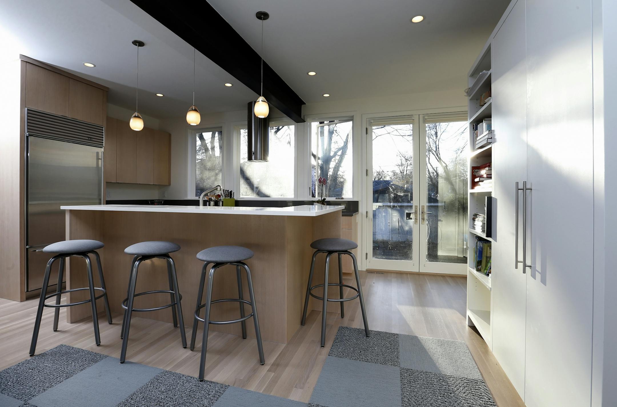 The new kitchen is open to the main-floor living spaces.