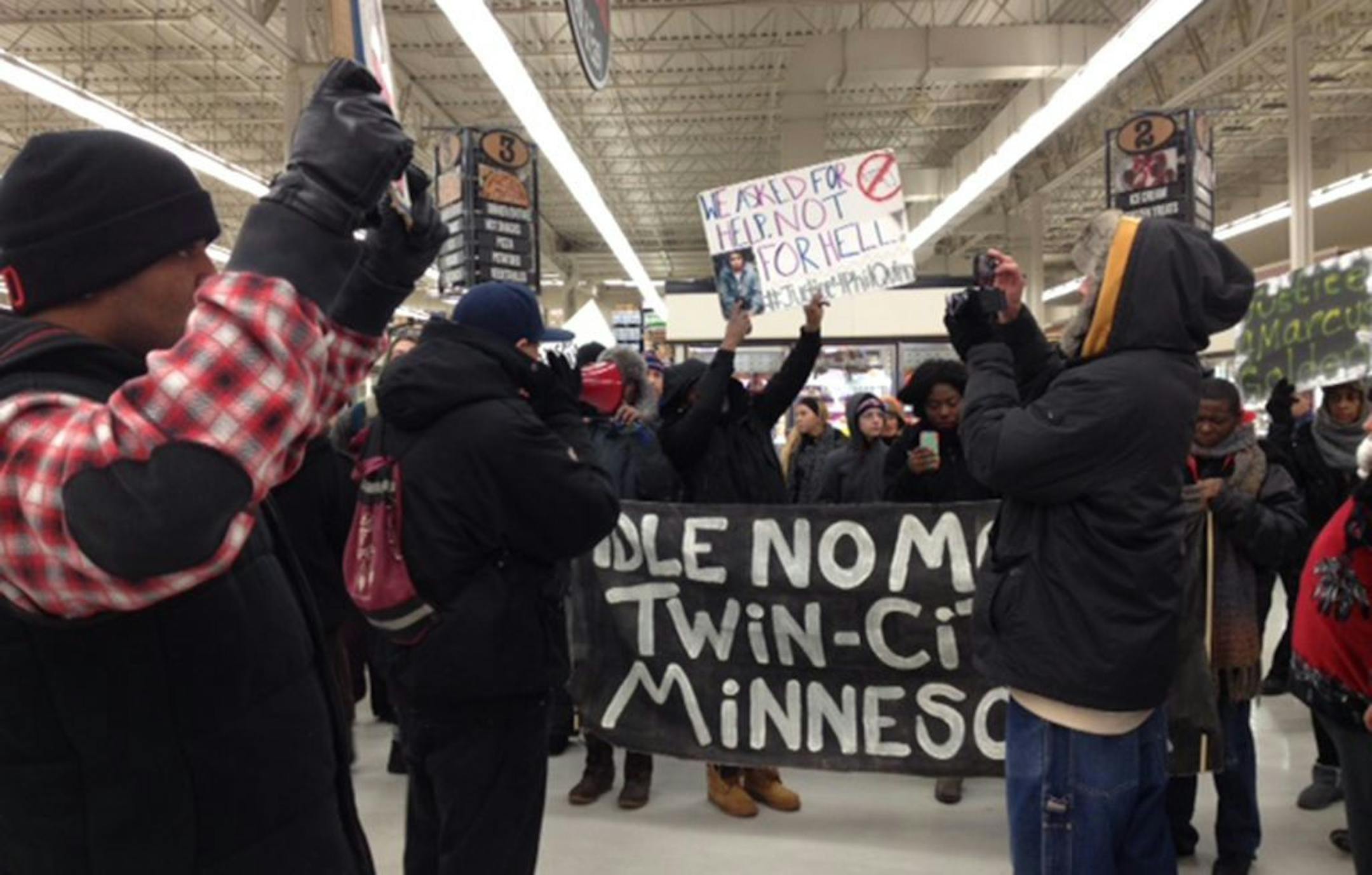 The group, which called itself "Justice for Philip Quinn," protested by going into retail shops along University Avenue in St. Paul, including this Cub Foods.