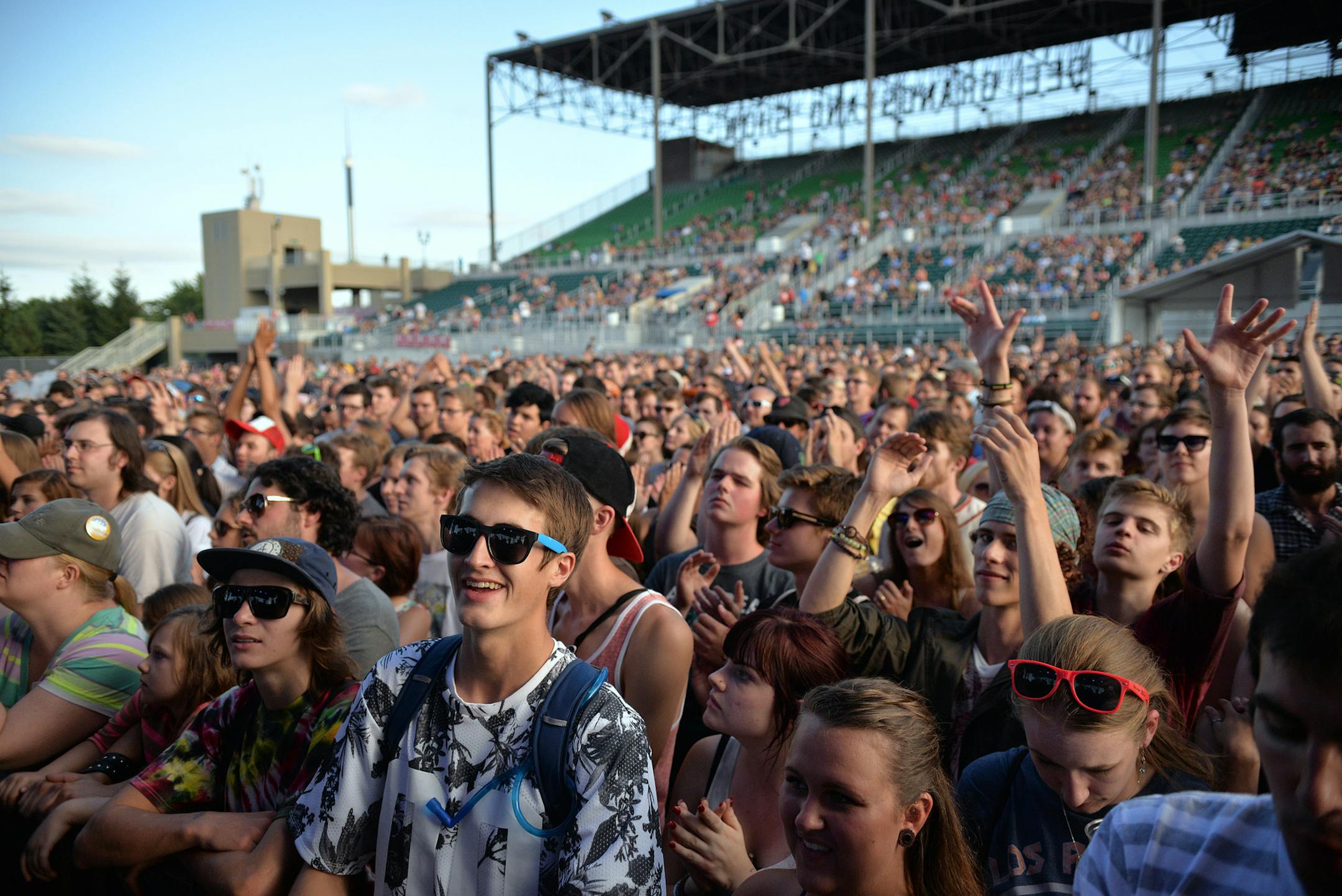 Fans cheer following Cloud Cult's opening song at the State Fair Grandstand.