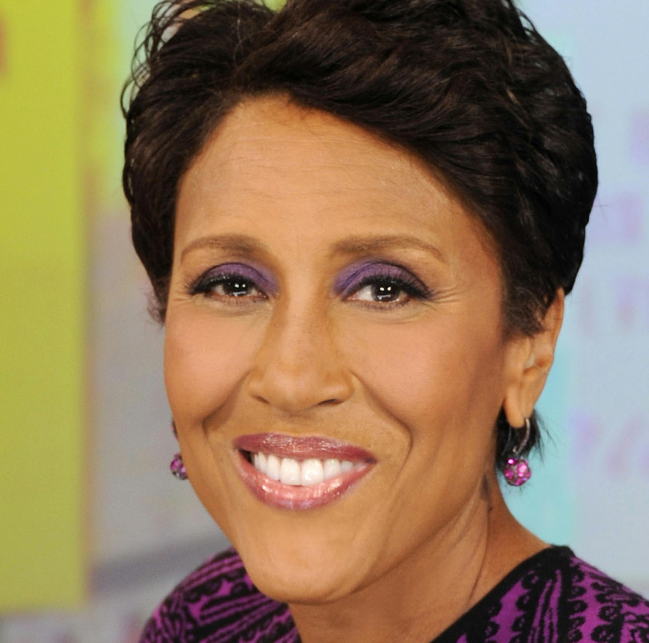 FILE - This June 26, 2012 file image originally released by ABC shows co-host Robin Roberts wearing an armband that covers her pic line chemotherapy treatment, on "Good Morning America," in New York. Roberts is taking a little time off, saying she's feeling the effects of her blood and bone marrow disease. Roberts said Tuesday that she's ìnot feeling too wellî and would take some time off ìjust to get some vacay.î ABC said Roberts would be taking a few weeks of previously sch