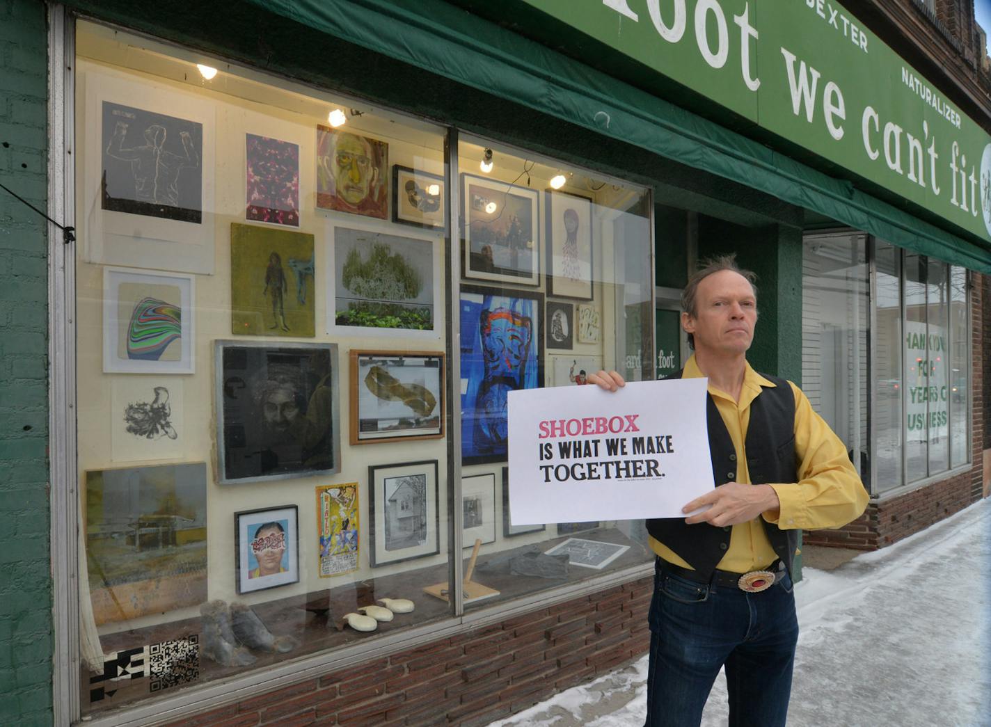 Photo by Sean Smuda Artist Sean Smuda stands in front of the storefront mini-gallery he&#x201a;&#xc4;&#xf4;s curated for the past 11 years. The gallery will close at Thanksgiving along with the store that house sit, Roberts Shoes.