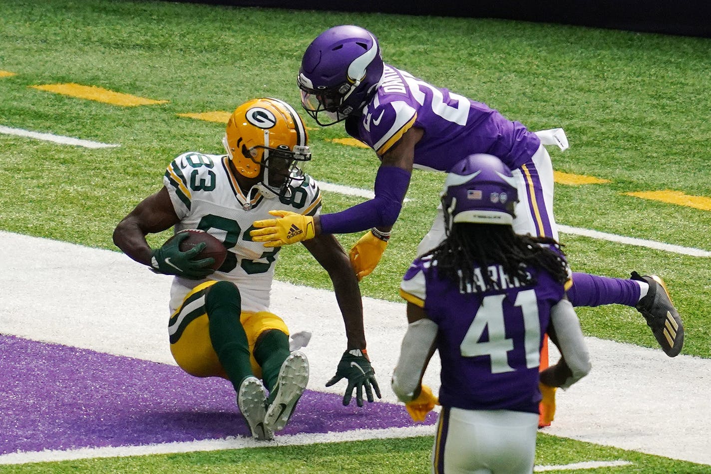 Green Bay Packers receiver Marquez Valdes-Scantling (83) caught a touchdown pass while being defended by Vikings rookie defensive back Cameron Dantzler (27) in the second quarter.