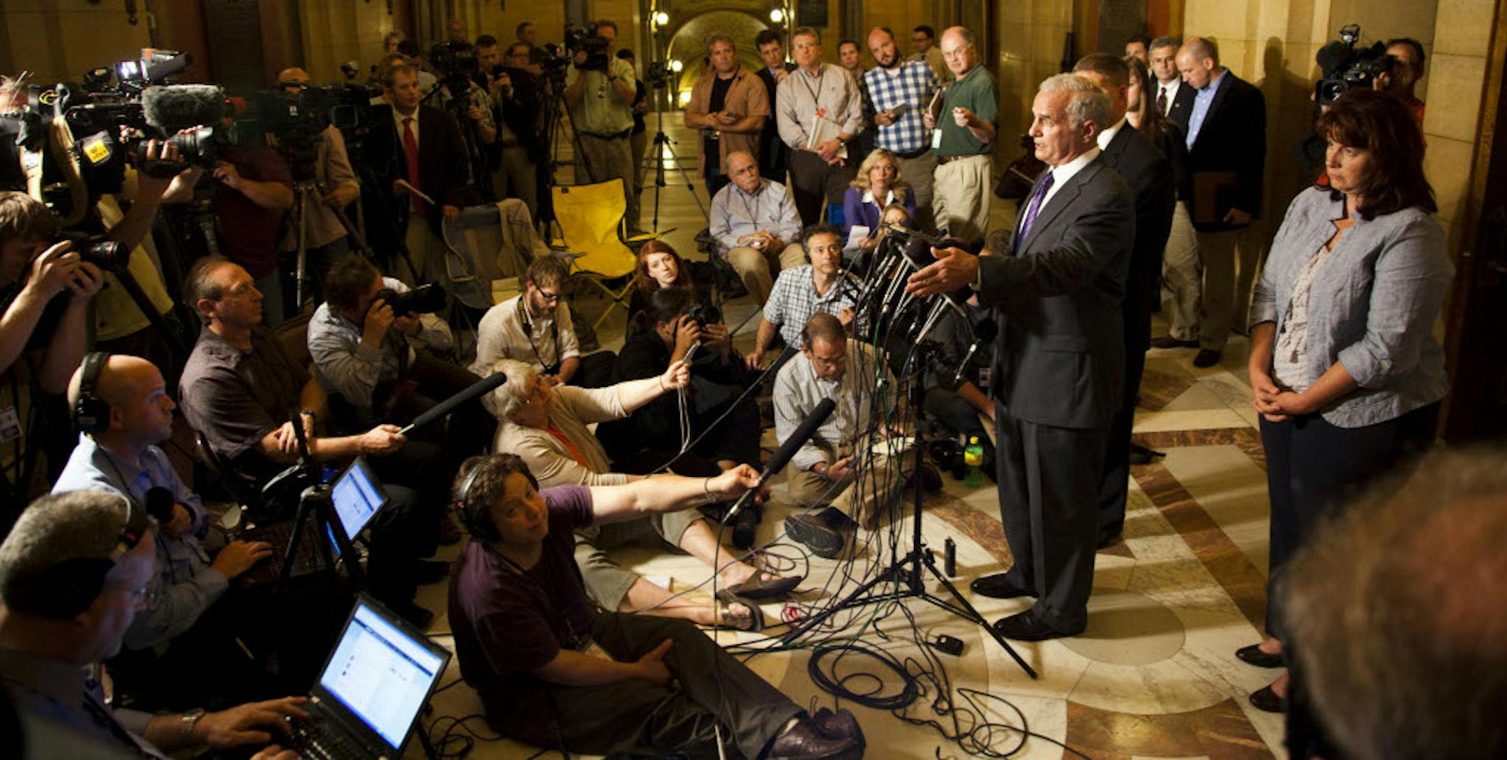 At right, State Sen. Amy Koch, Minnesota Gov. Mark Dayton and state Rep. Kurt Zellers address the media after reaching a tentative budget agreement.