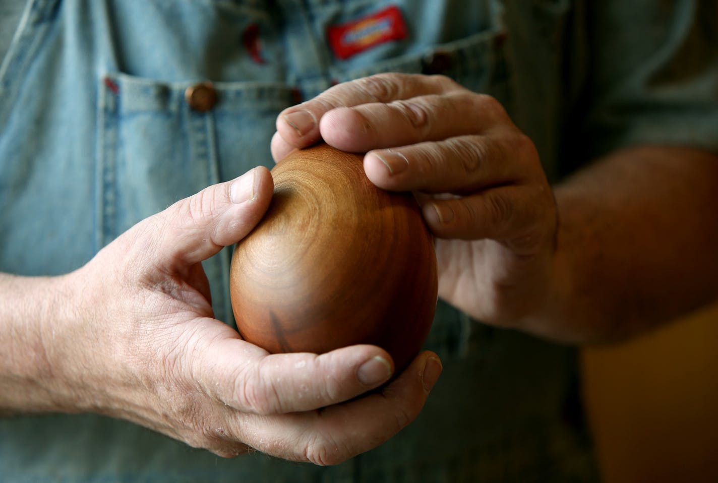 "You learn to see with your hands," said artist George Wurtzel, at his shop, Wednesday, June 11, 2014 in Minneapolis, MN. Wurtzel, makes wood furniture and decorative objects despite being completely blind since his late teens. He "sees" the wood grain by steaming it and feeling the raised grooves. "I'm always pawing through people's backyard woodpiles and finding great raw material," says Wurtzel, who also teaches other blind people how to work with wood. ] (ELIZABETH FLORES/STAR TRIBUNE) ELIZA