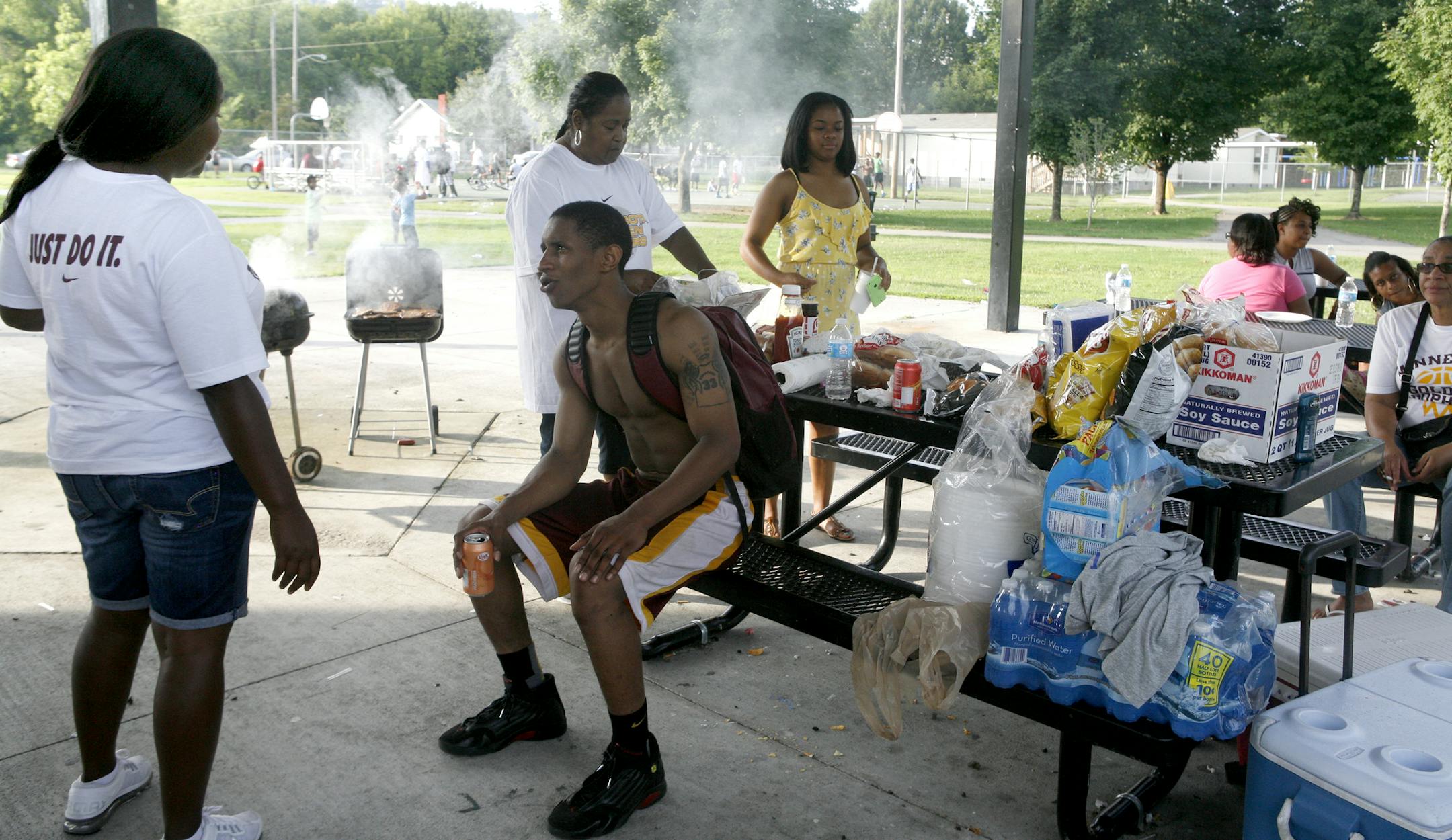 Mathieu grabs an orange soda and a hot dog and makes the rounds at the neighborhood cookout. In the background, aunt Robin Johnson mans the grill, churning out more than 100 hot dogs and hamburgers for whoever showed up.[ 891693 Like every summer, DeAndre Mathieu, the Minnesota mens basketballl team's most critical player heading into the 2014-15 season, went home to Knoxville in August.
