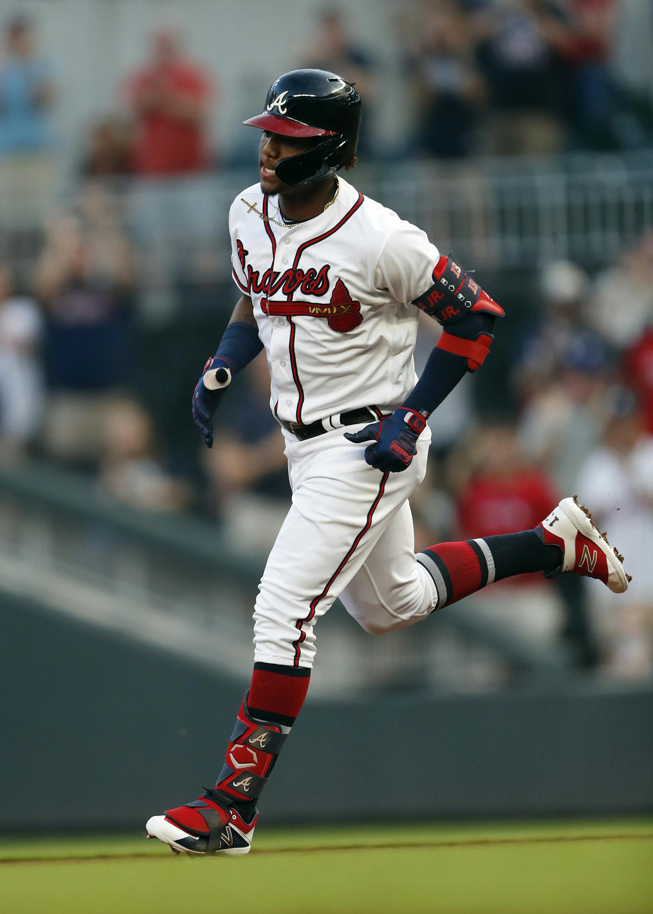 Atlanta Braves' Ronald Acuna Jr. rounds the bases after hitting a grand slam in the second inning of a baseball game against the Pittsburgh Pirates, Monday, June 10, 2019, in Atlanta. (AP Photo/John Bazemore)