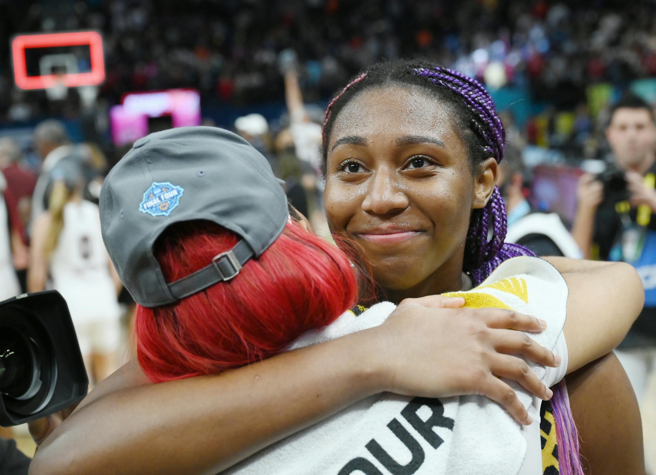 South Carolina forward Aliyah Boston (4) hugs South Carolina forward Victaria Saxton (5) following their 64-49 win over UConn.