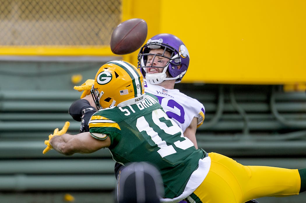 Vikings strong safety Harrison Smith has been praised by Packers quarterback Aaron Rodgers for his ability to disguise his intentions. Here he breaks up a pass to Packers wide receiver Equanimeous St. Brown in 2020.